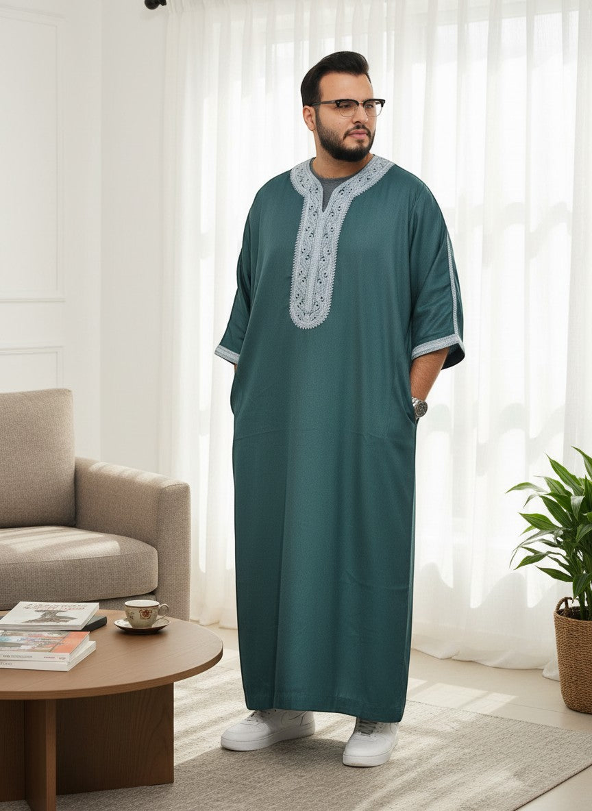 The Topi Wala men's forest green thobe with intricate grey embroidery on the neckline and sleeves. Lightweight fabric, full length.