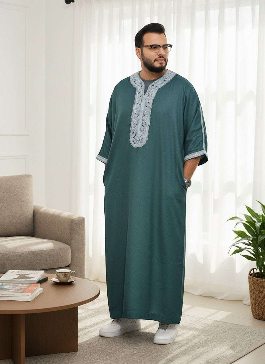 The Topi Wala men's forest green thobe with intricate grey embroidery on the neckline and sleeves. Lightweight fabric, full length.
