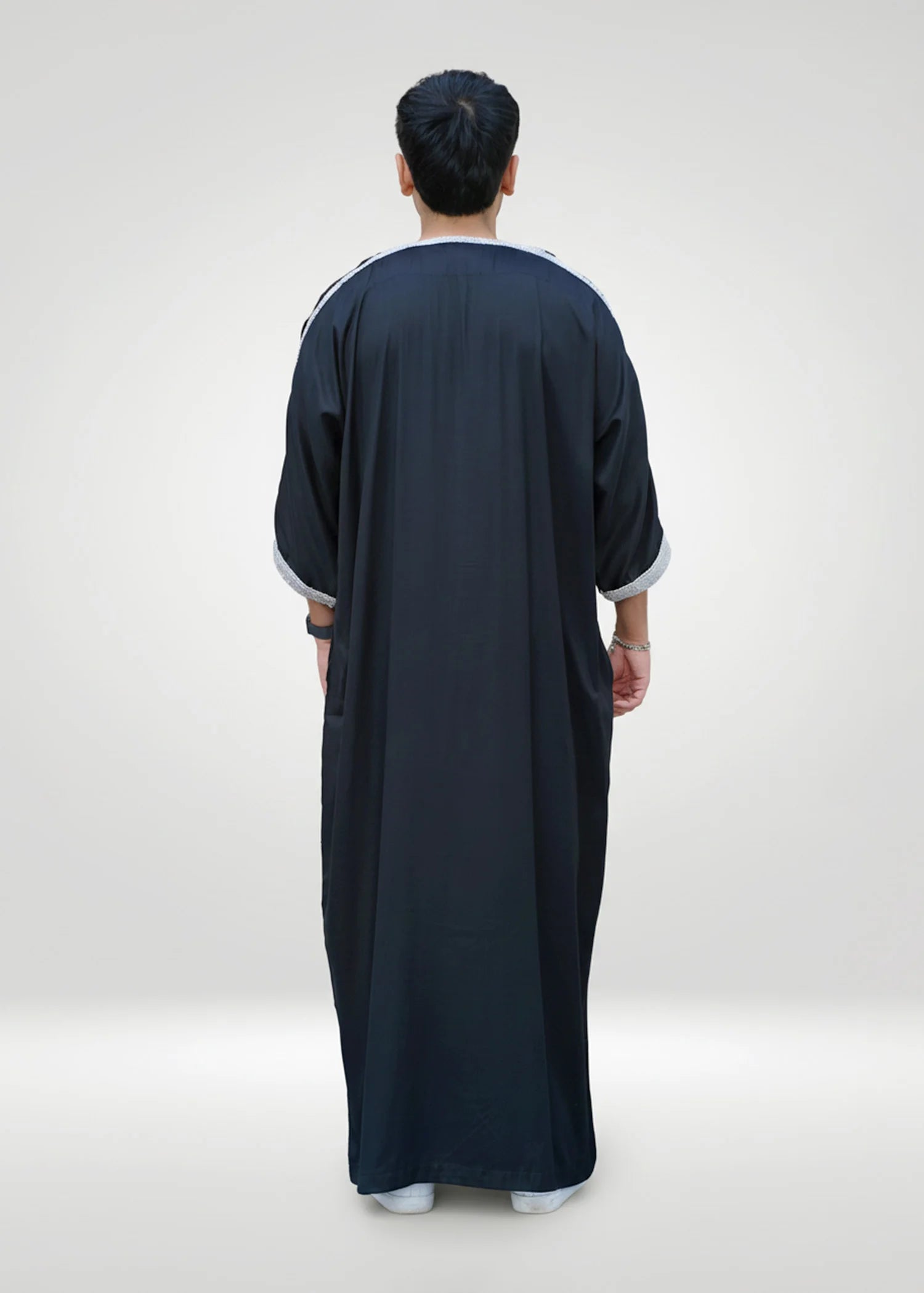 Detail shot focusing solely on the structured mandarin collar and upper gold embroidery.