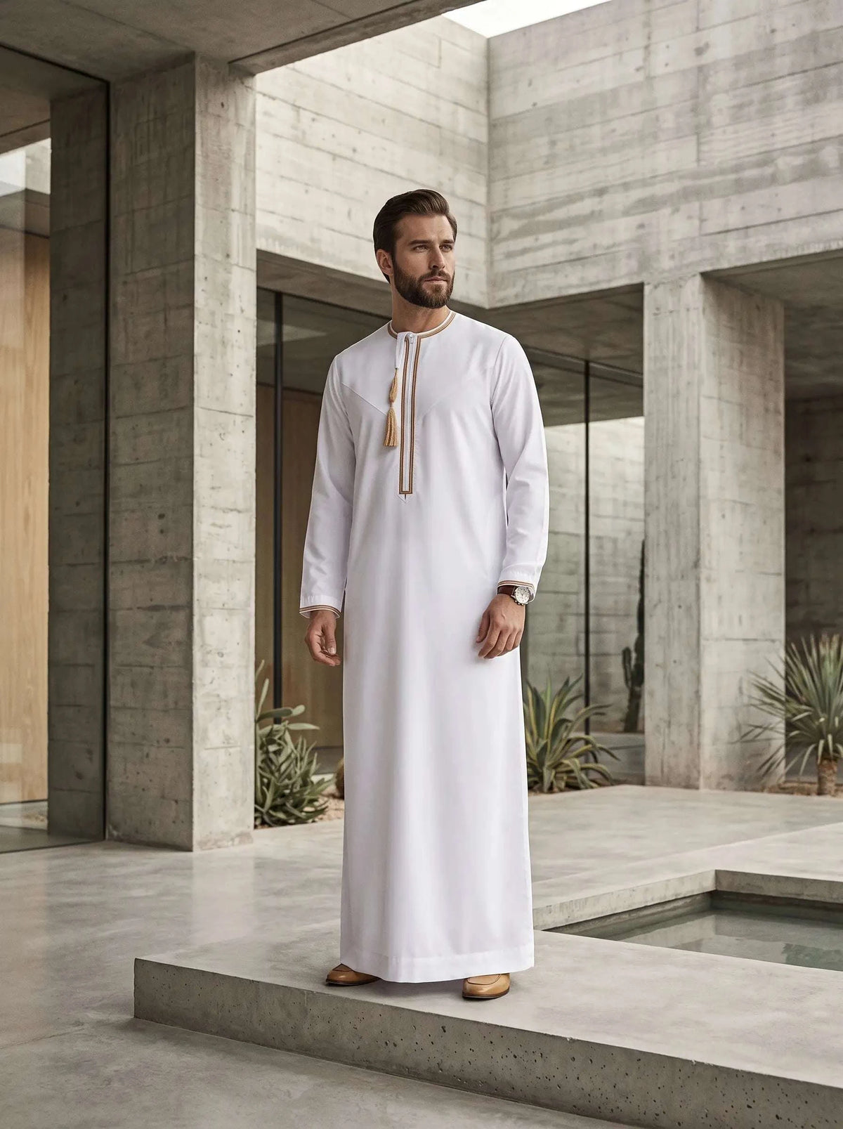 White Emirati thobe for men, close-up of the embroidered detailing
