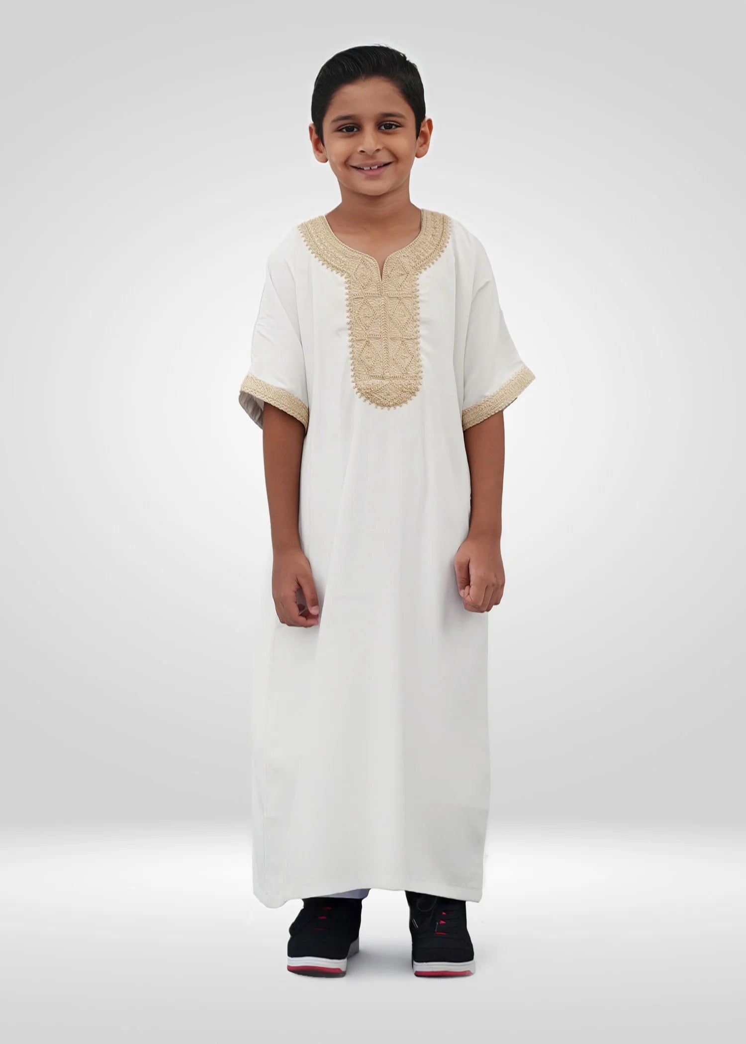 Front view of the White/Gold Moroccan Kids Thobe showing the crisp fabric and regal embroidery