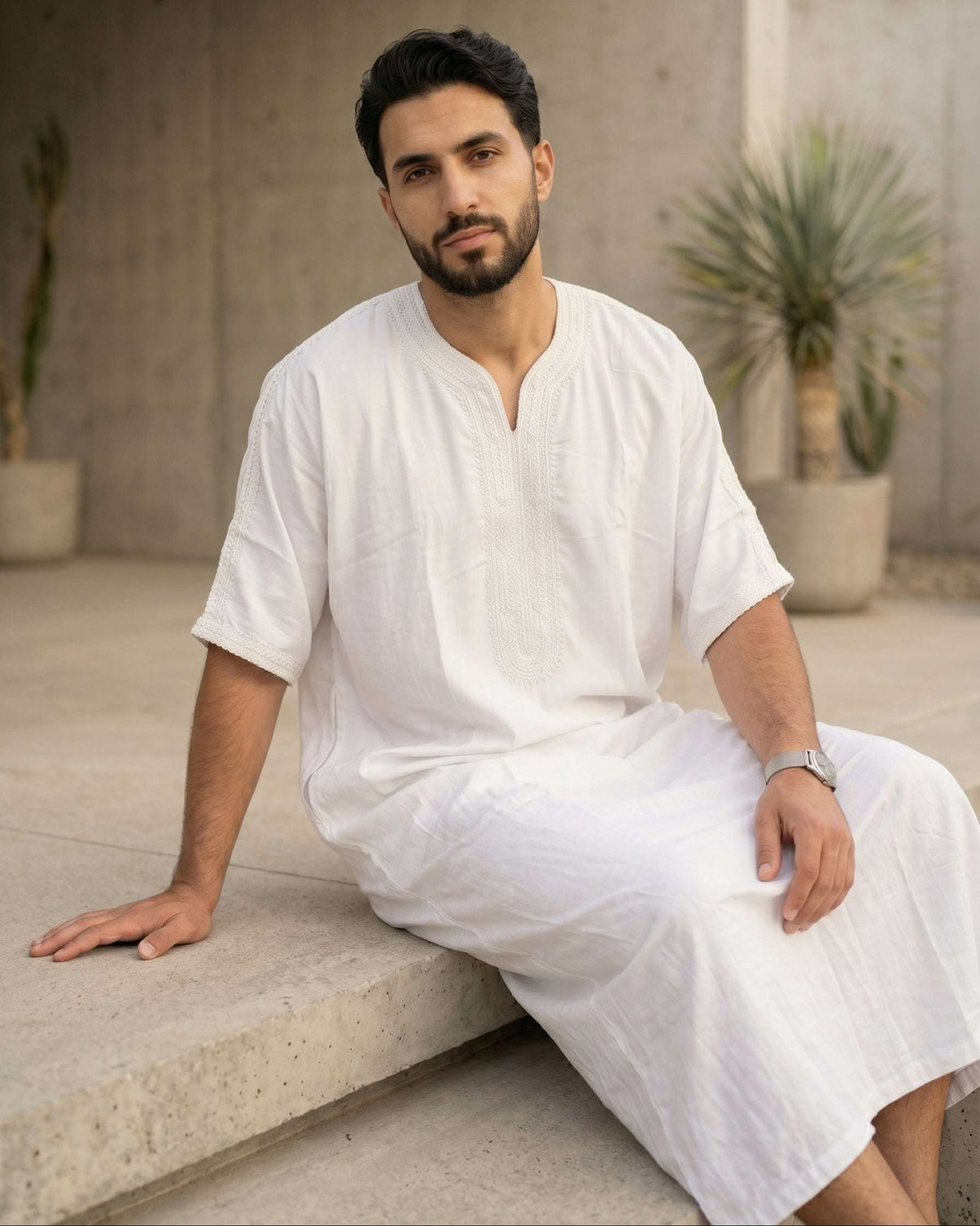 White Moroccan thobe with tone-on-tone embroidery for men, close-up of the embroidered detailing