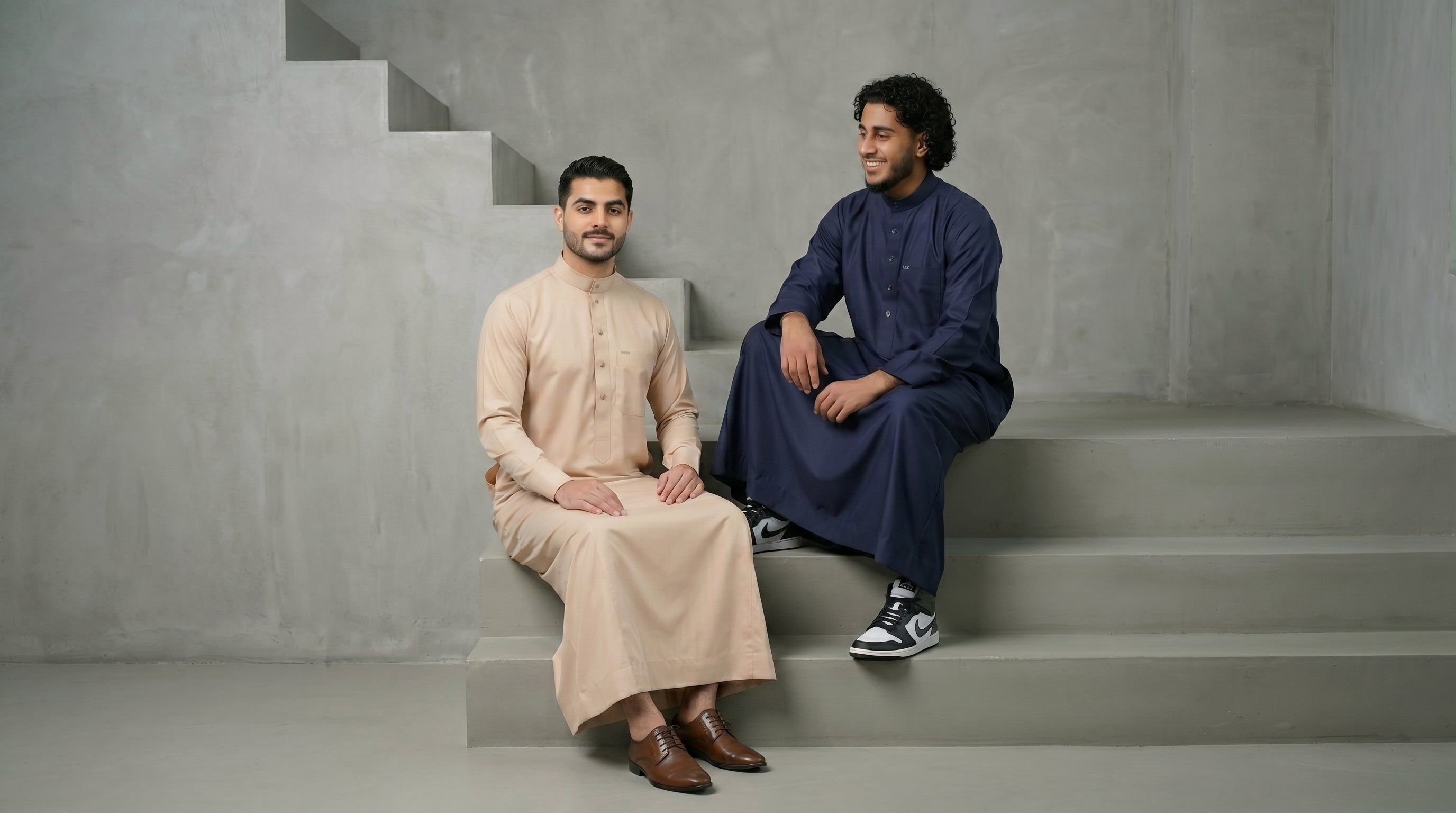 A stylish comparison of men's thobes by The Topiwala, featuring a modern Sand Beige earth tone thobe and a classic Slate Blue thobe, highlighting modern Muslim menswear.