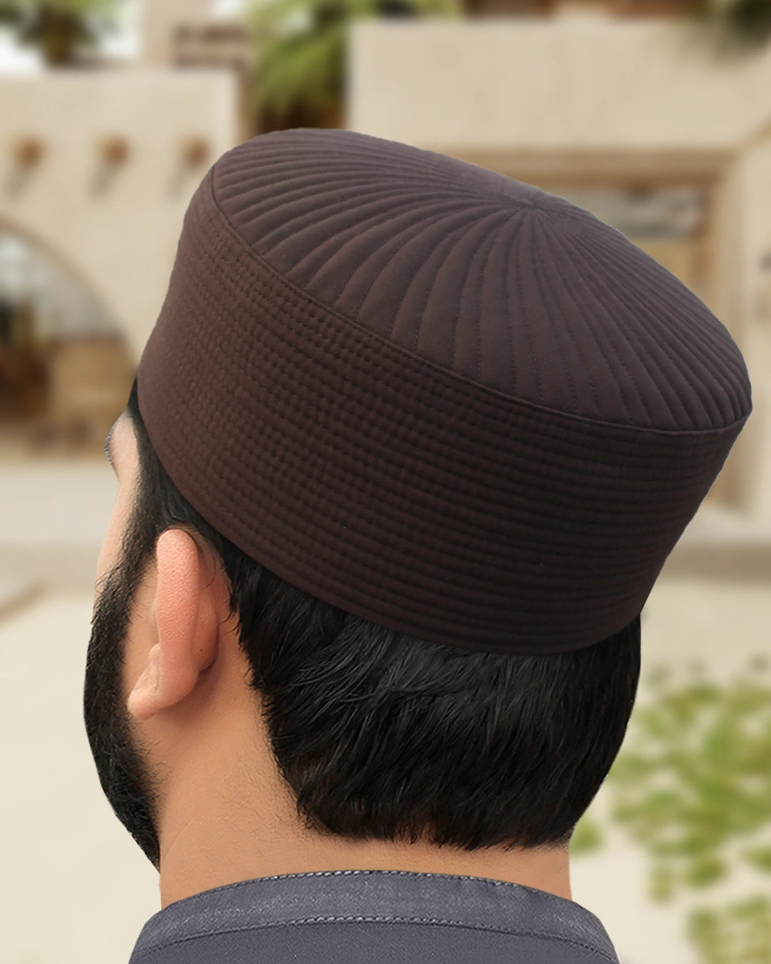 Back view of the Chocolate Brown Kufi, highlighting the secure, stable fit.