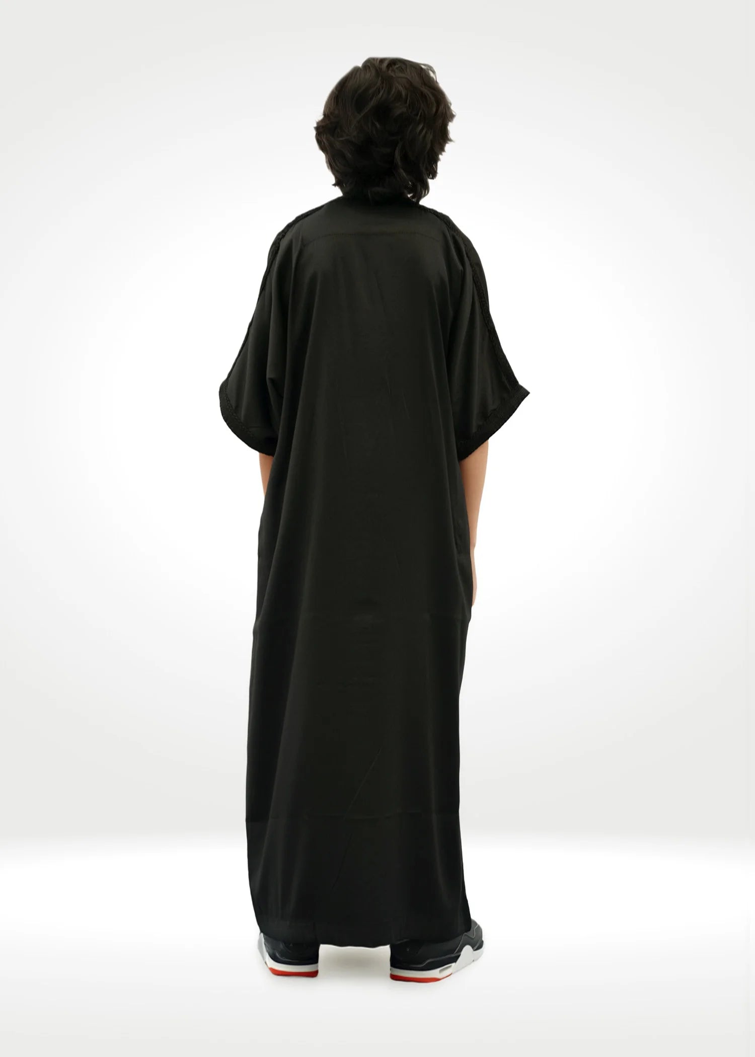 Back view of the Black Moroccan Kids Thobe highlighting the simple, elegant silhouette