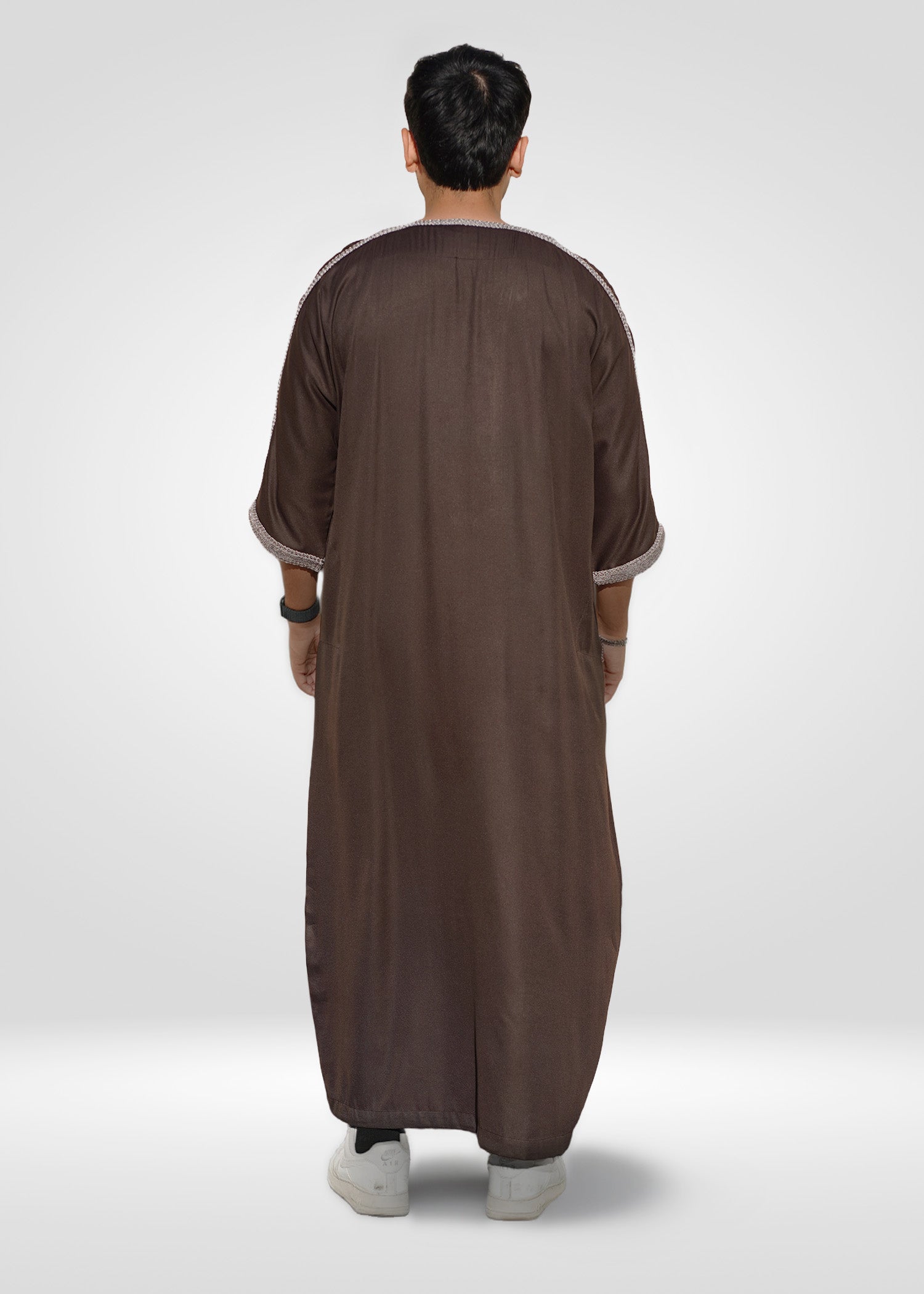 Flat lay image of the folded Espresso Beans Moroccan Thobe showing the premium embroidery contrast