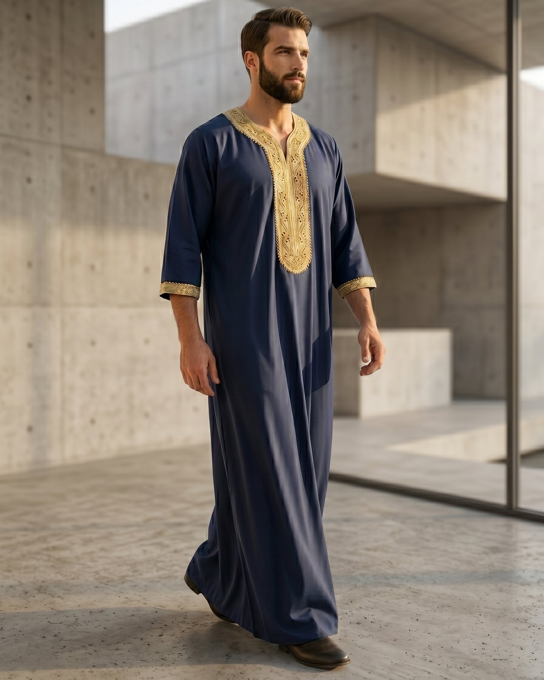 Authentic Moroccan style men's gandora in navy blue and gold, luxury Islamic menswear, modest apparel for Muslims, traditional Middle Eastern clothing, premium three quarter sleeve thobe, best Eid clothing for men.