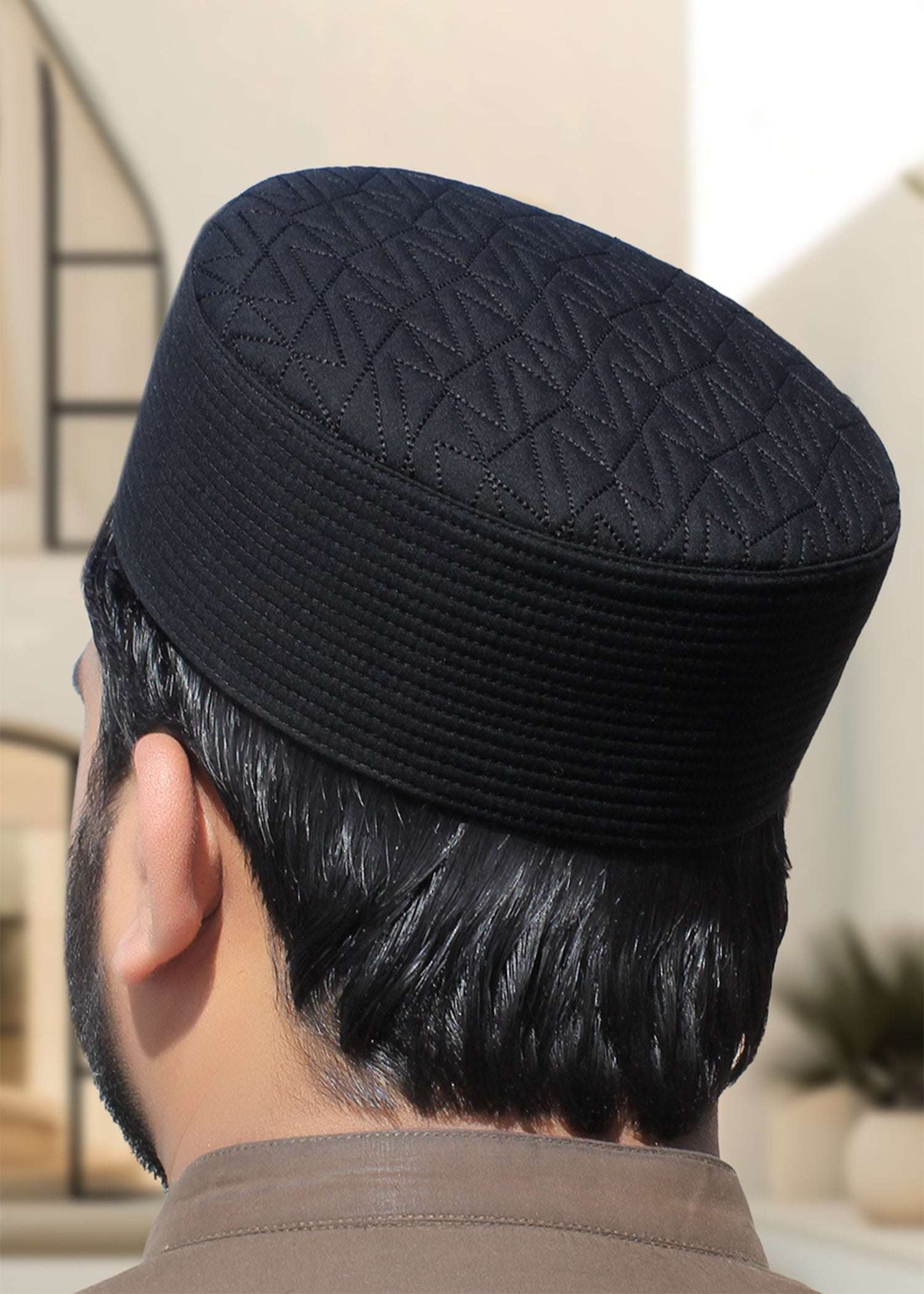 Chevron quilted structured kufi prayer cap for men, shown from the front