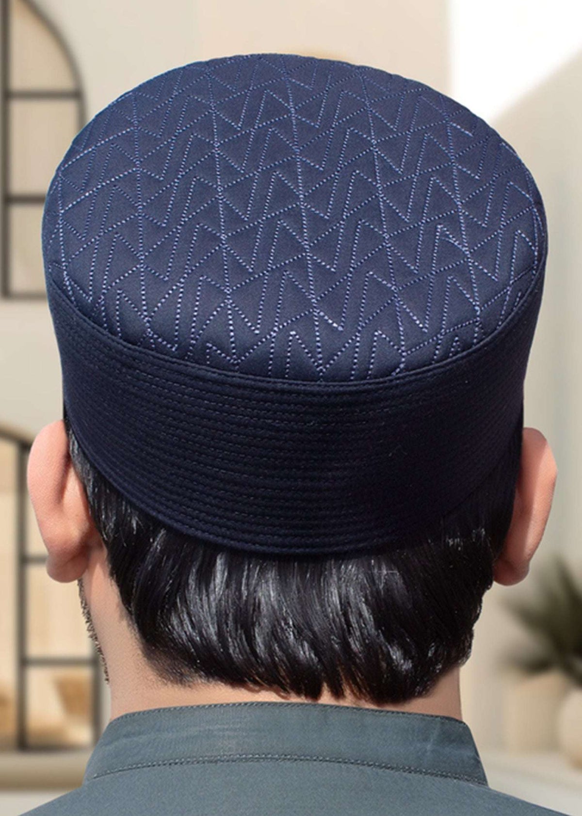 Chevron quilted structured kufi prayer cap for men, shown from the side