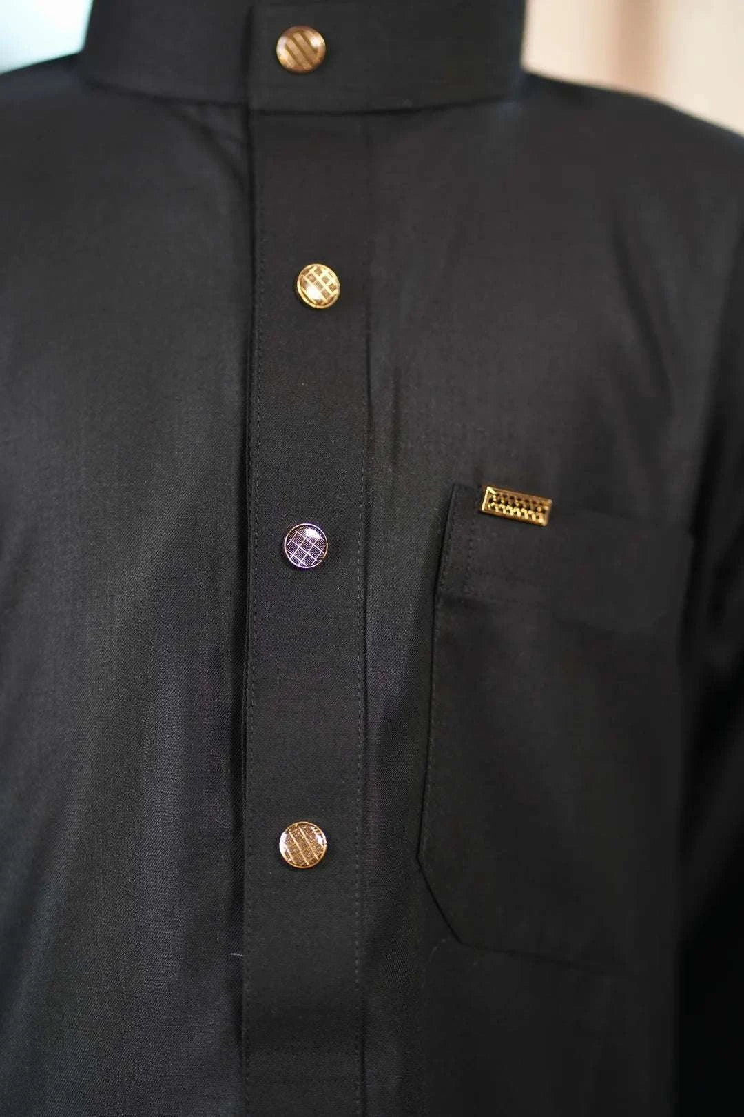 Black thobe for boys, close-up of the collar and buttons