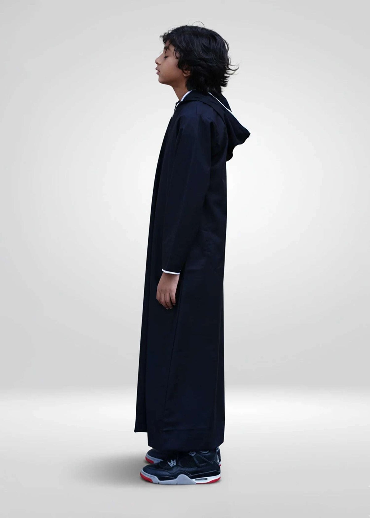 Black hoodie thobe with white piping trim for boys, hood and drawstring in detail