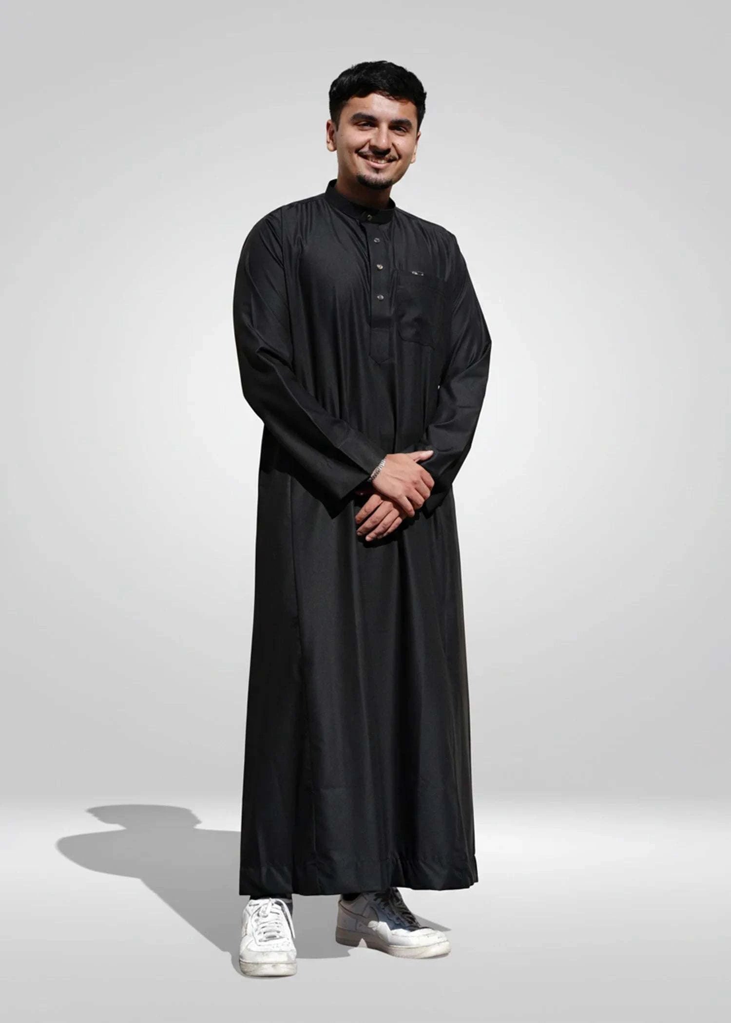 Black thobe with mandarin collar for men, showing the length and sleeve line