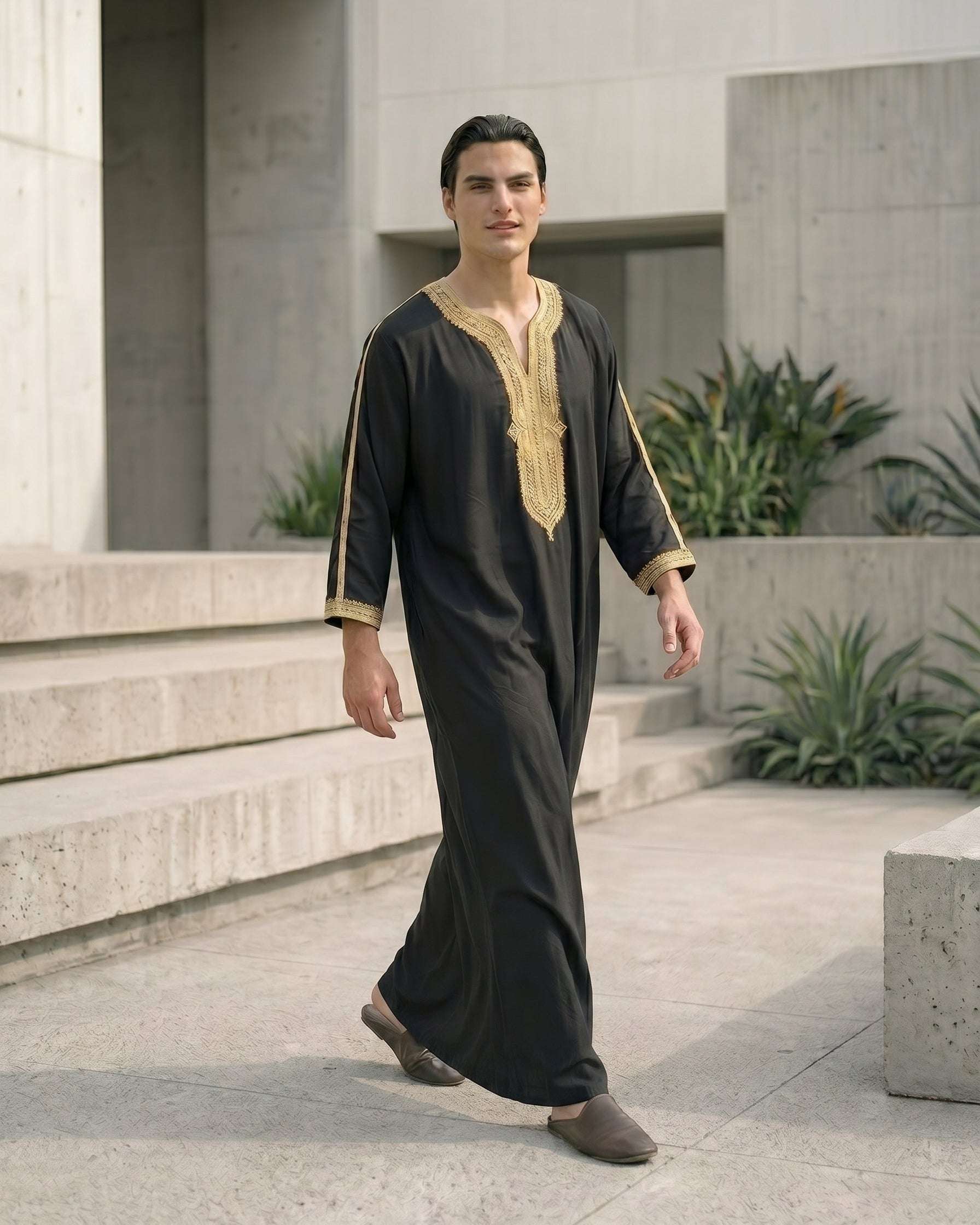 Black Moroccan thobe with gold embroidery for men, close-up of the fabric