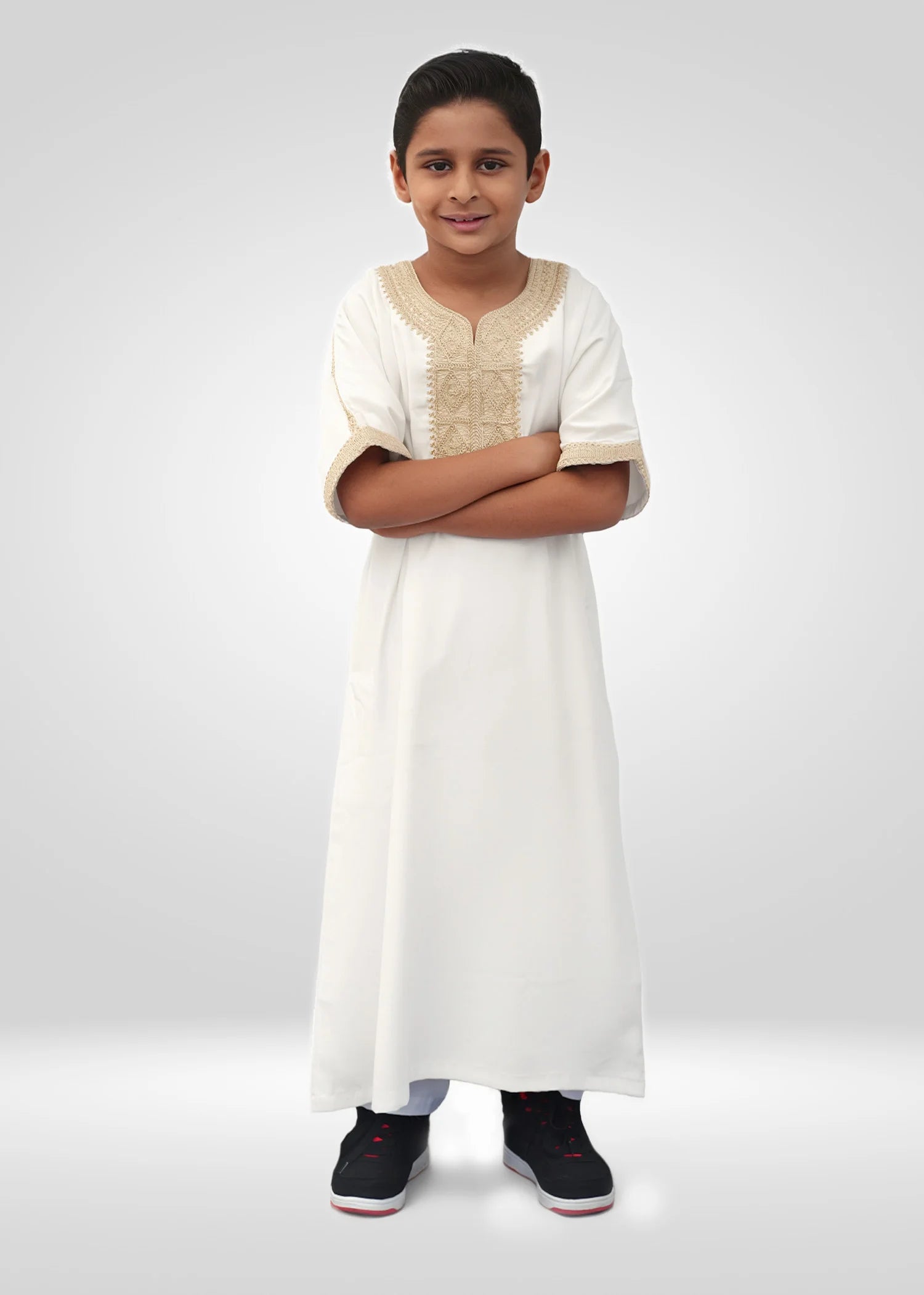 Side view of the white gandora showing the breezy short sleeve design and gold cuff detail