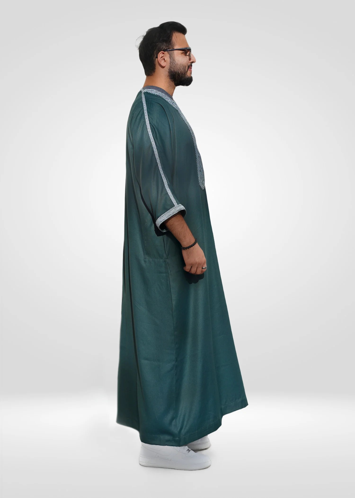Back view highlighting the elegant drape of the lightweight green fabric, perfect for sophisticated modest wear.