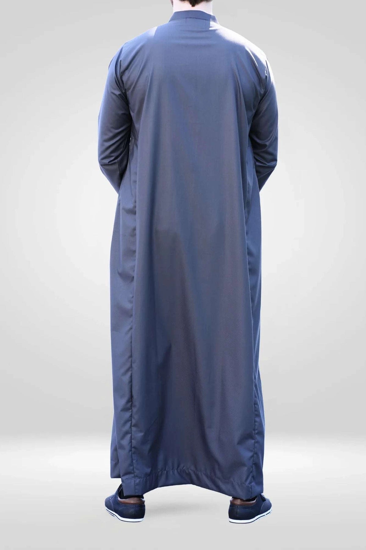 Charcoal thobe with mandarin collar for men, worn by a model outdoors