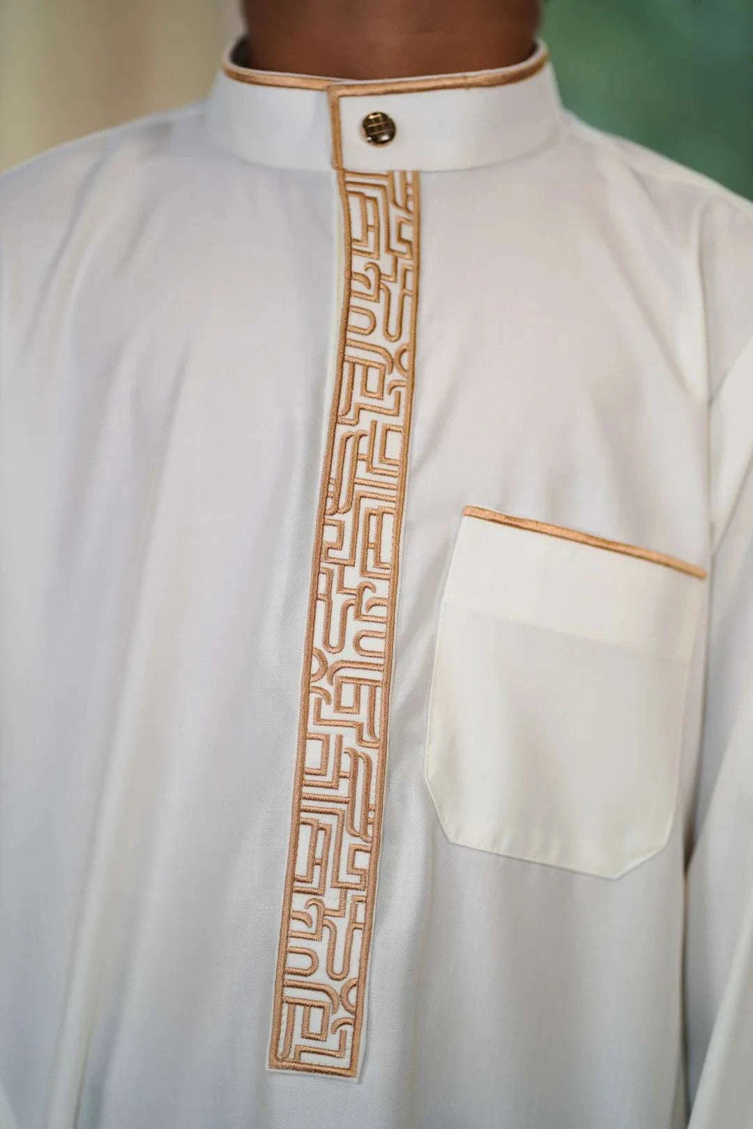 Cream and gold embroidered thobe for boys, close-up of the collar and buttons