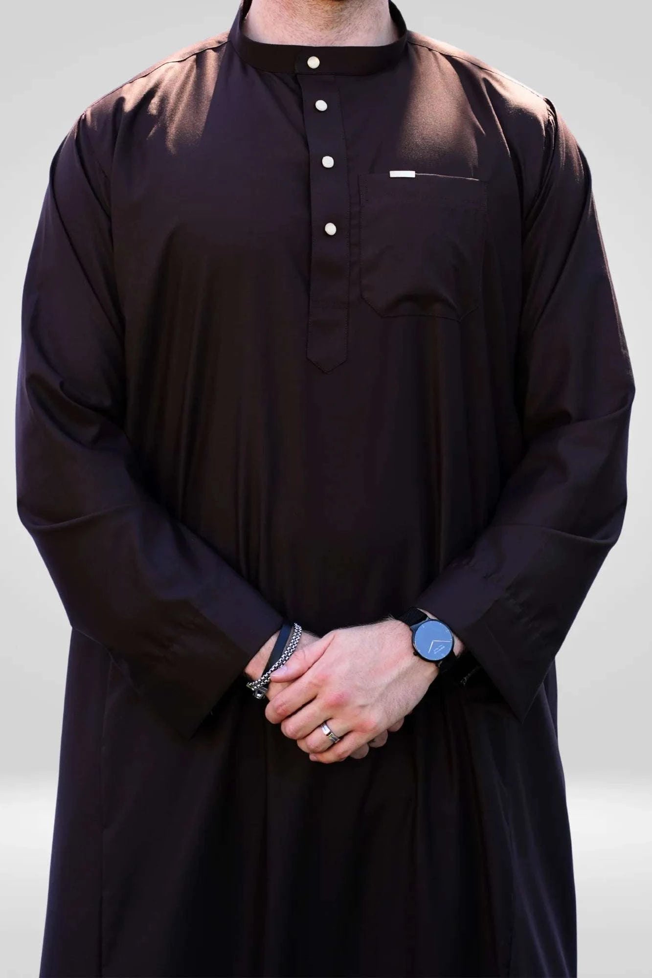 Dark brown thobe with mandarin collar for men, buttoned placket in close detail