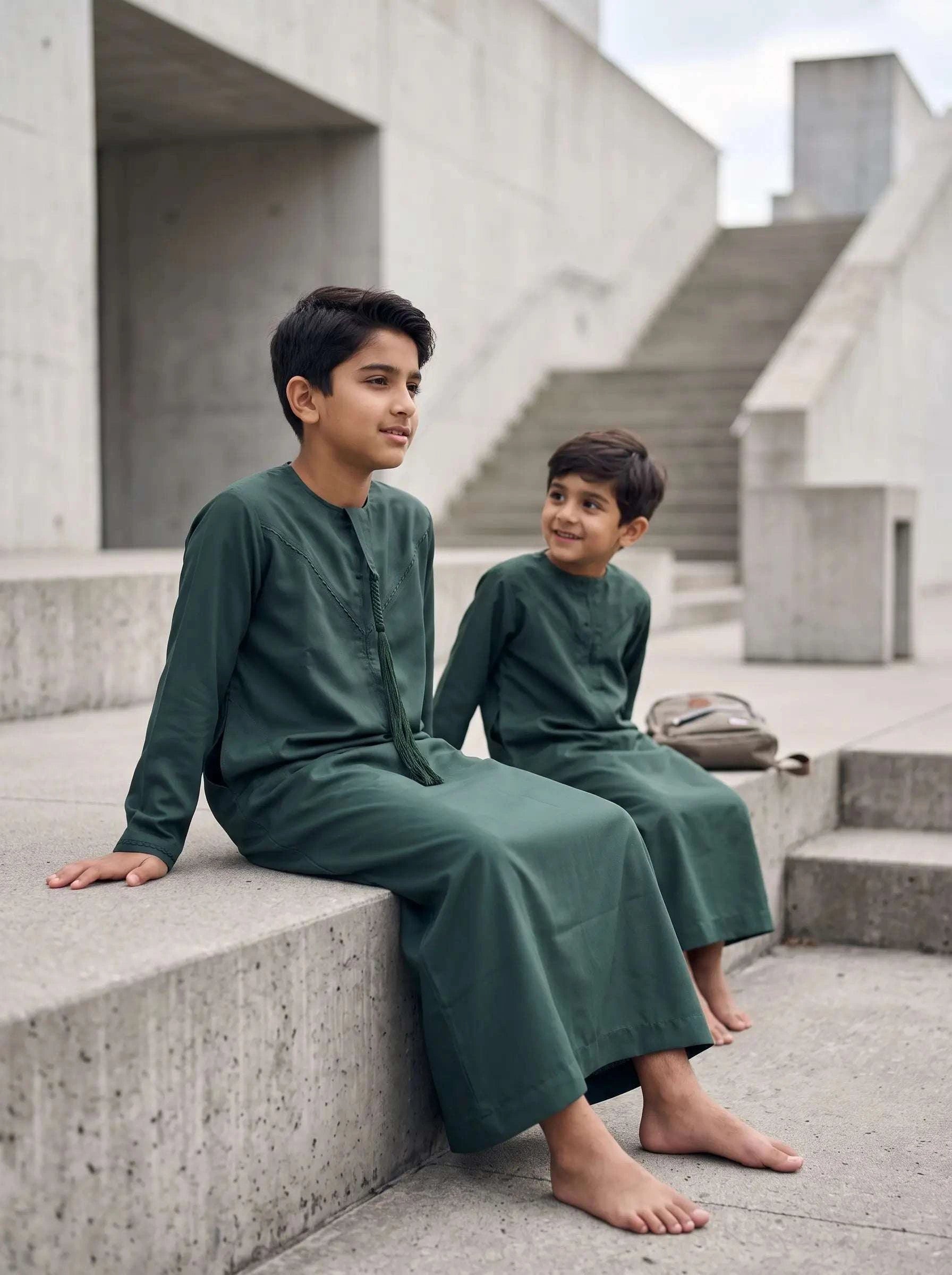 Dark green Emirati jubba for boys, fabric weave in close detail