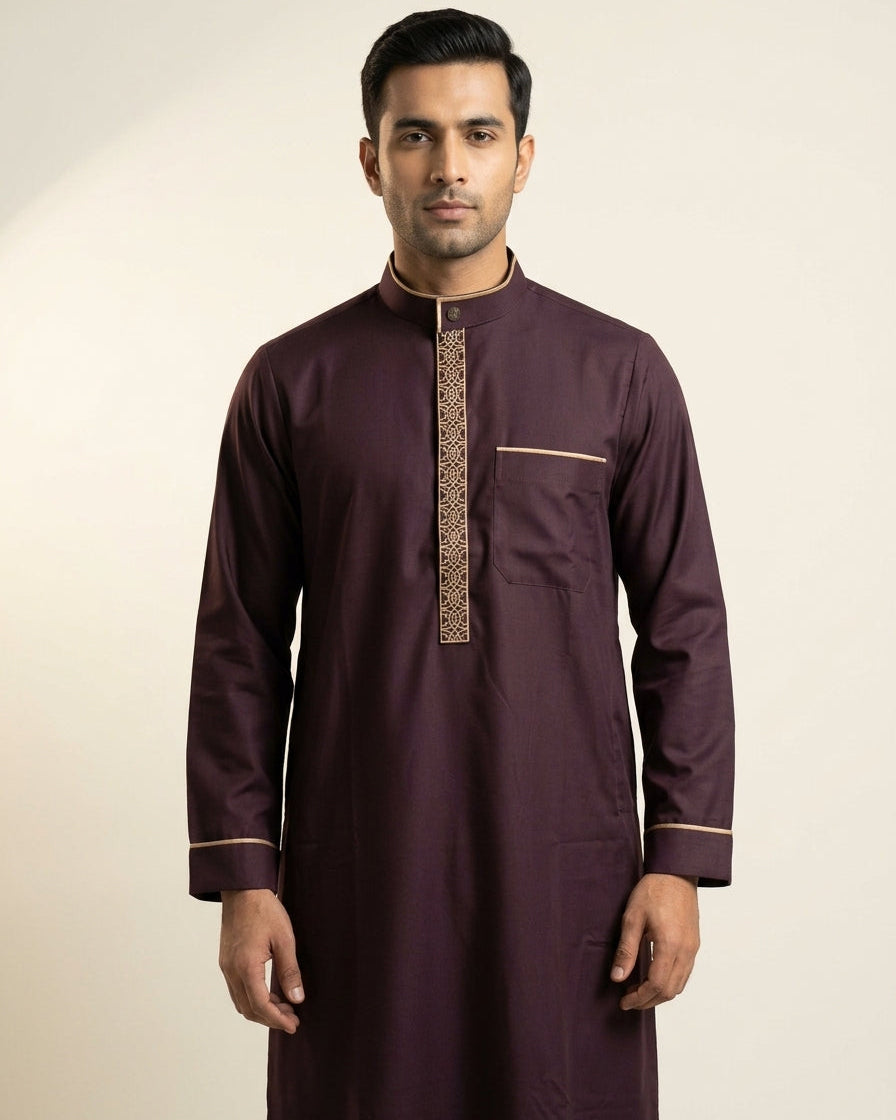 Elegant dark maroon men's thobe with sleek bronze accents, premium modest fashion, comfortable Friday prayer clothes, formal Muslim men's apparel, high-quality long sleeve jubbah, designer Islamic garments.