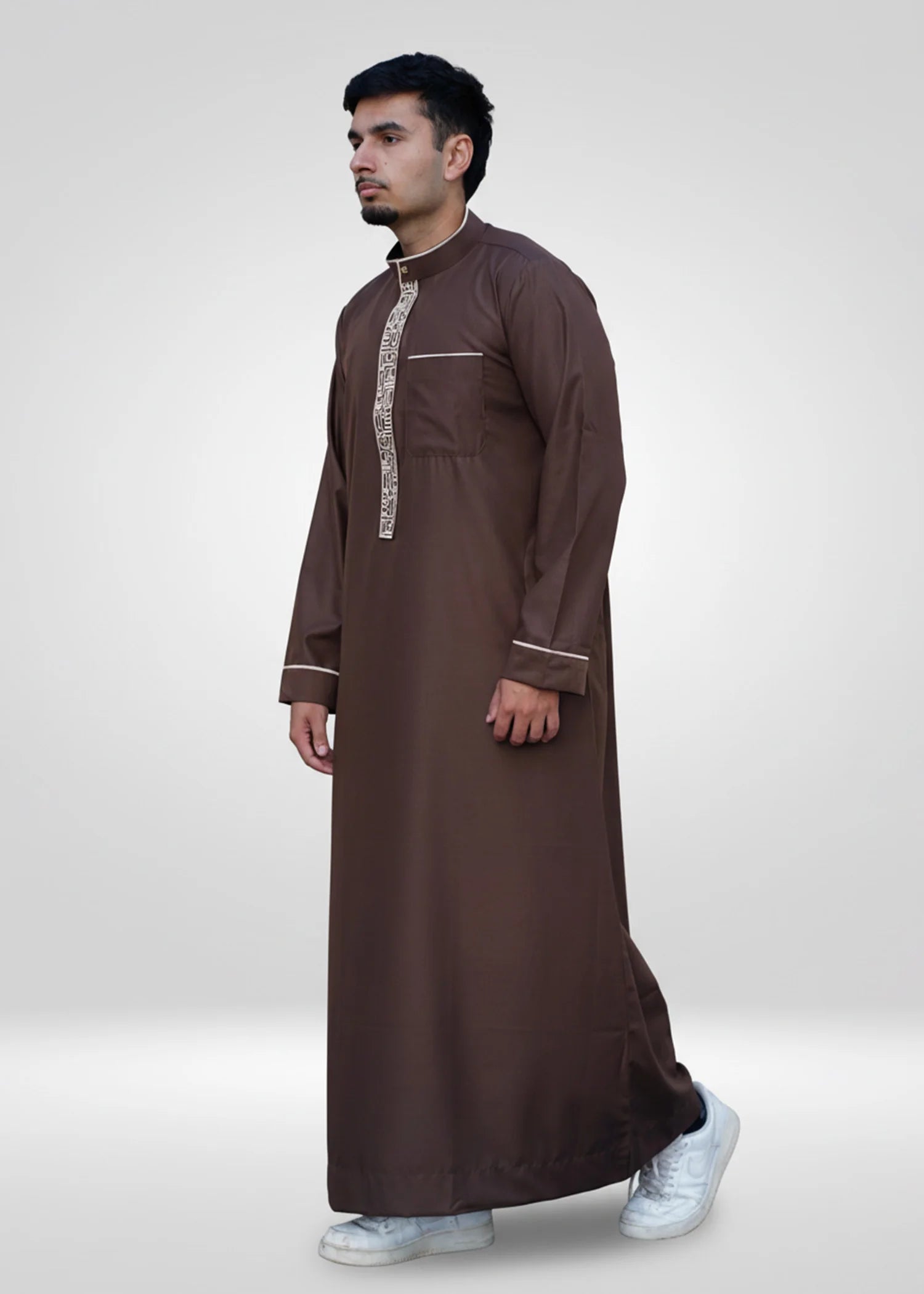 Detail shot focusing solely on the structured mandarin collar and gold trim for formal Islamic attire.