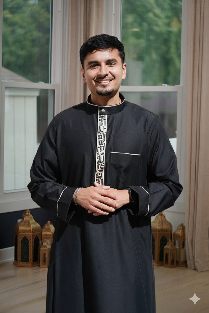 Close up of the luxurious gold embroidery on the chest and mandarin collar of the men's jubba