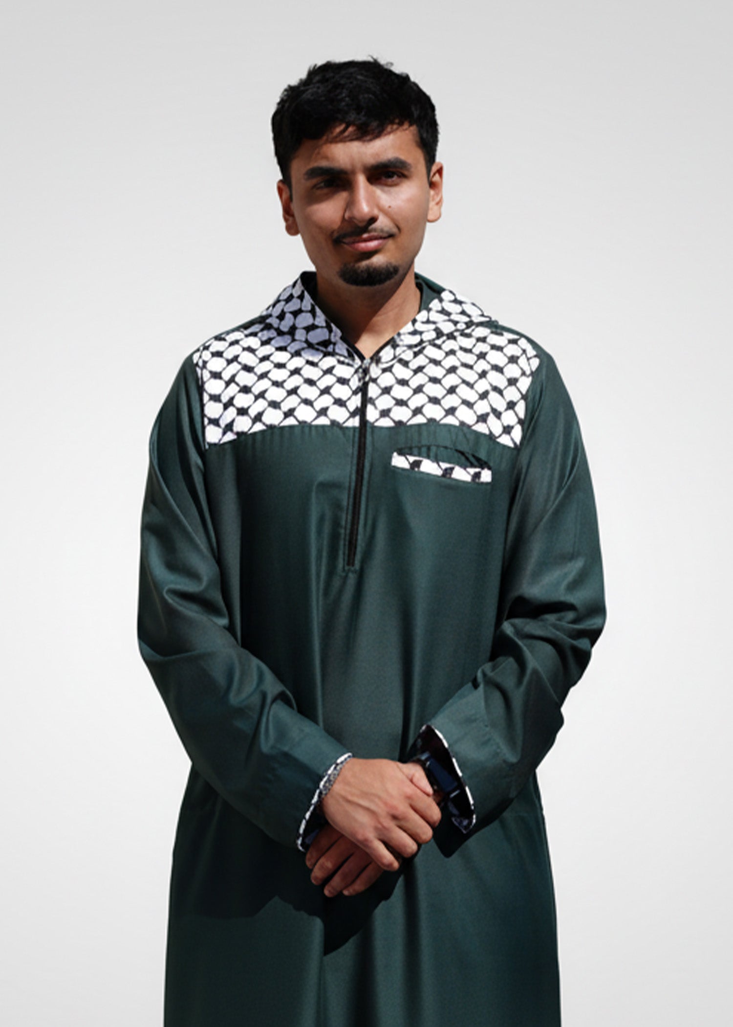 Detail shot of the front zipper and patterned hood on the forest green casual thobe