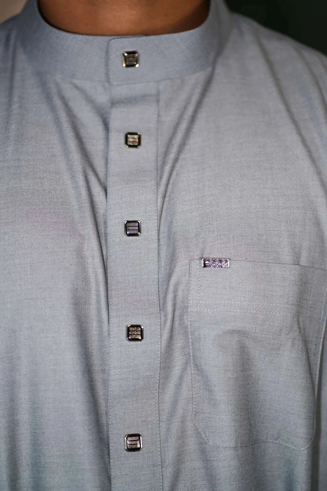 Light gray thobe for boys, close-up of the collar and buttons