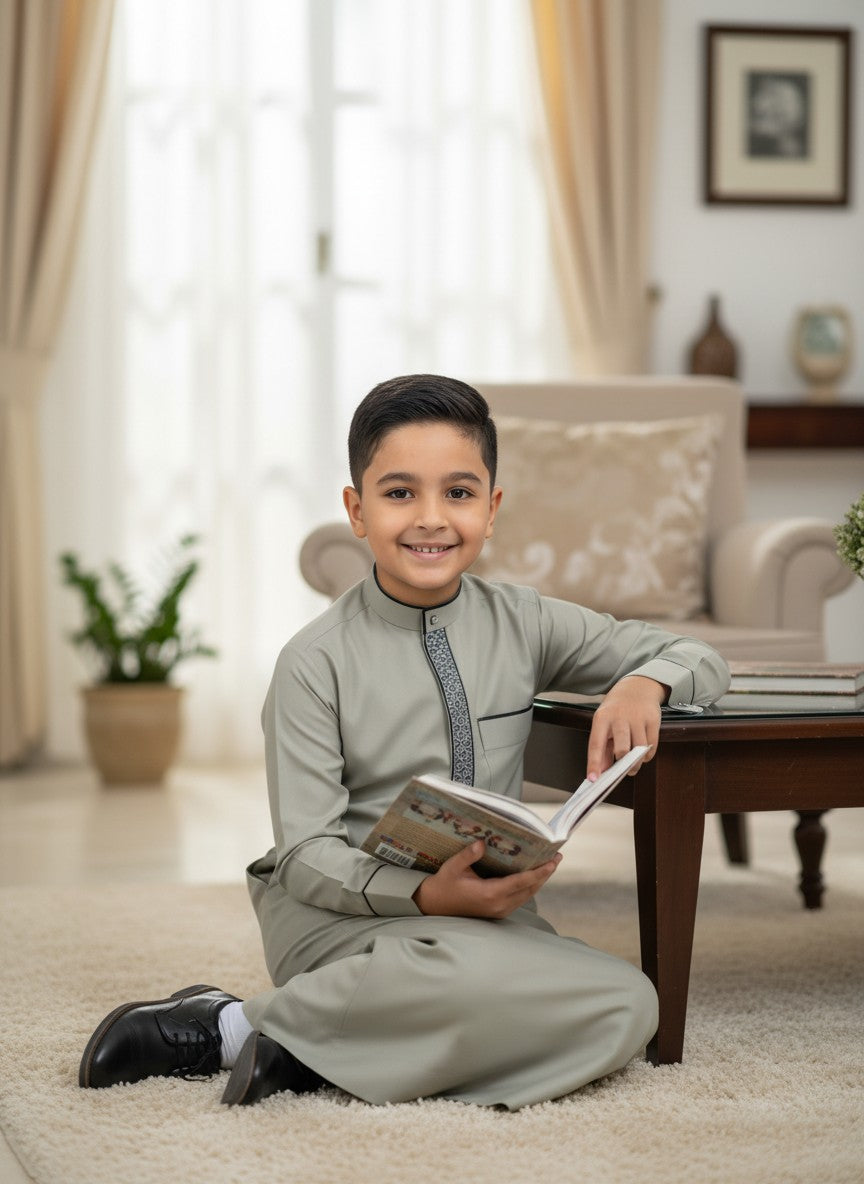 grey boys thobe, embroidered kids jubba, formal thobe for boys, mandarin collar thobe, modern kids jubba, boutique islamic clothing, boys sunnah clothing, affordable kids thobe, premium muslim boys wear, designer kids jubba, modest boys fashion, traditional muslim clothes.