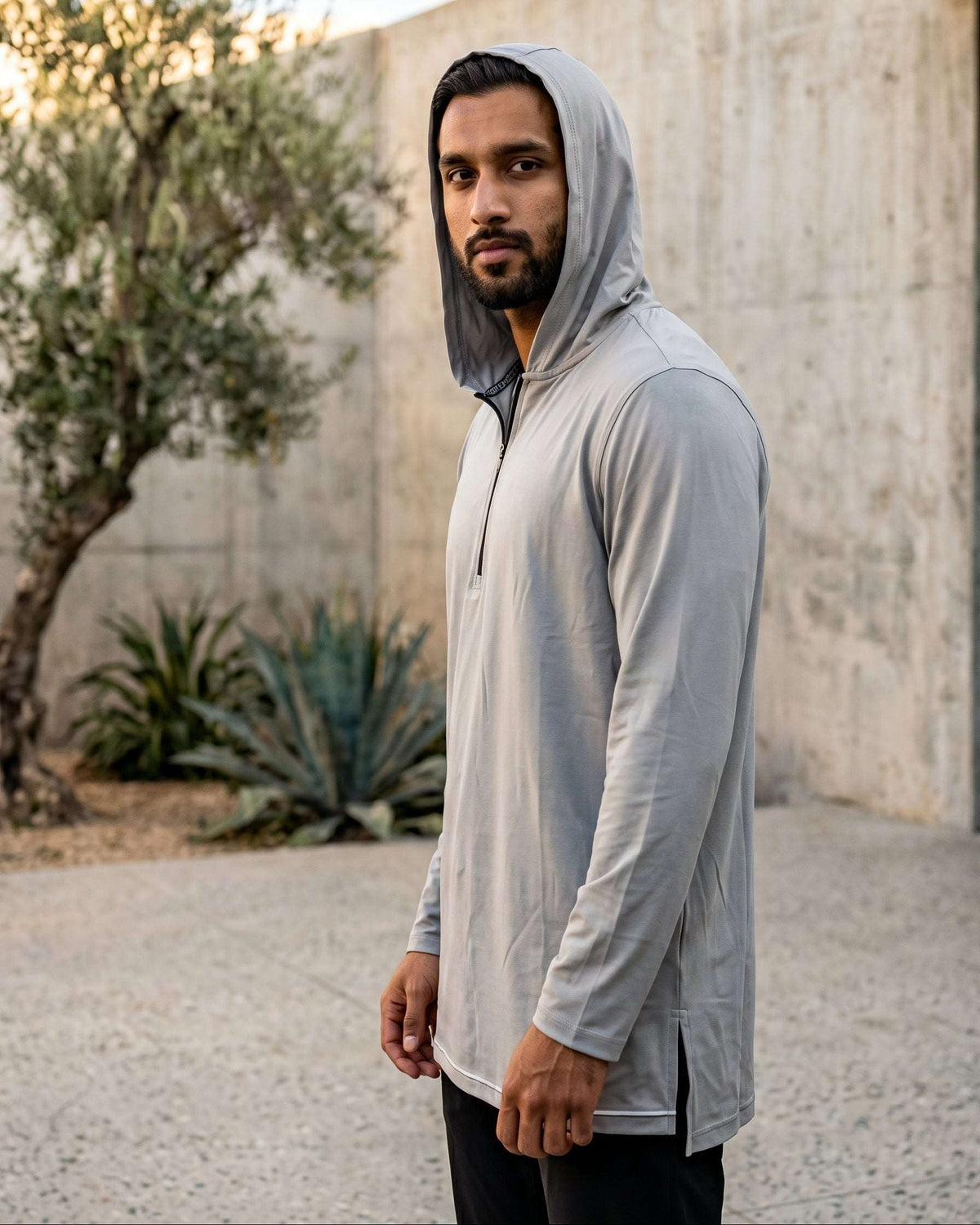 Light grey hooded kurta with half-zip jersey for men, close-up of the zip pull