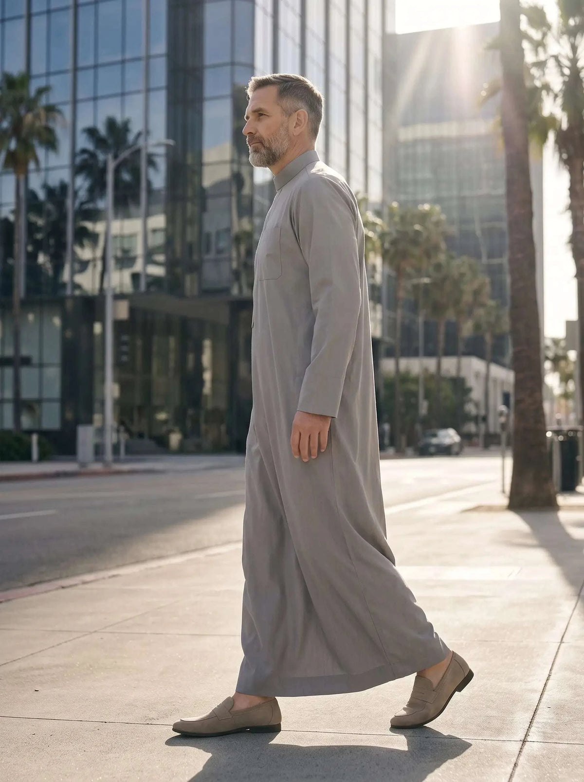 Light grey minimalist thobe with hidden placket for men, side profile view
