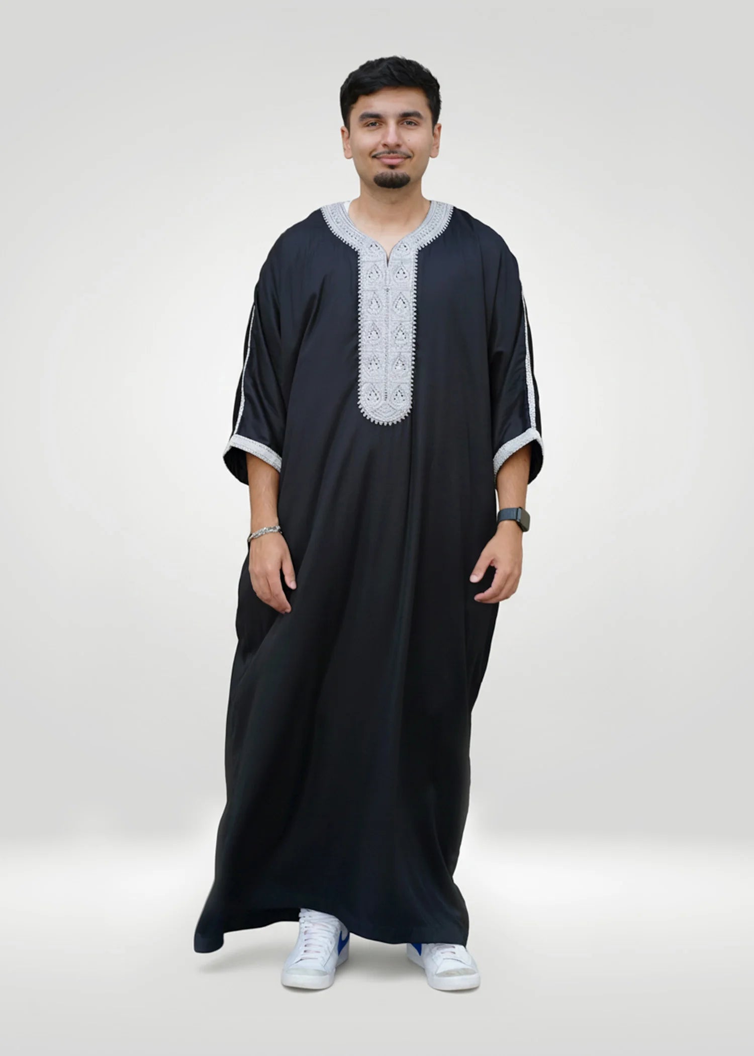 Lifestyle shot of a man wearing the black and silver gandora, looking confident and stylish