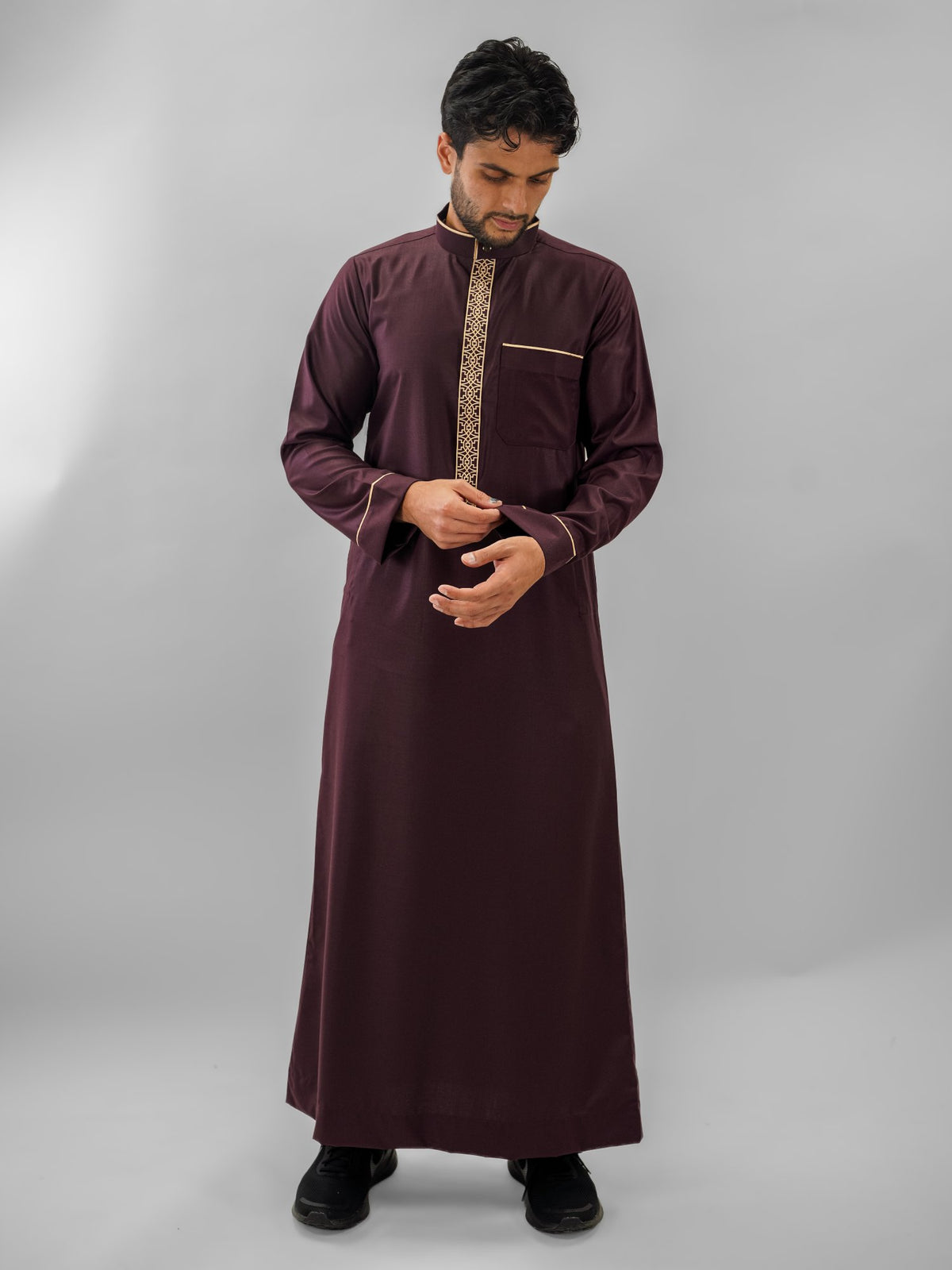 Maroon executive bronze embroidery thobe for men, close-up of the fabric