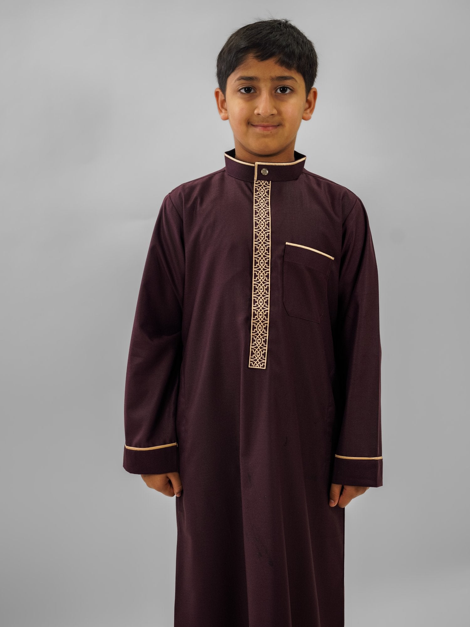 Maroon gold embroidered mandarin collar thobe for boys, close-up of the fabric
