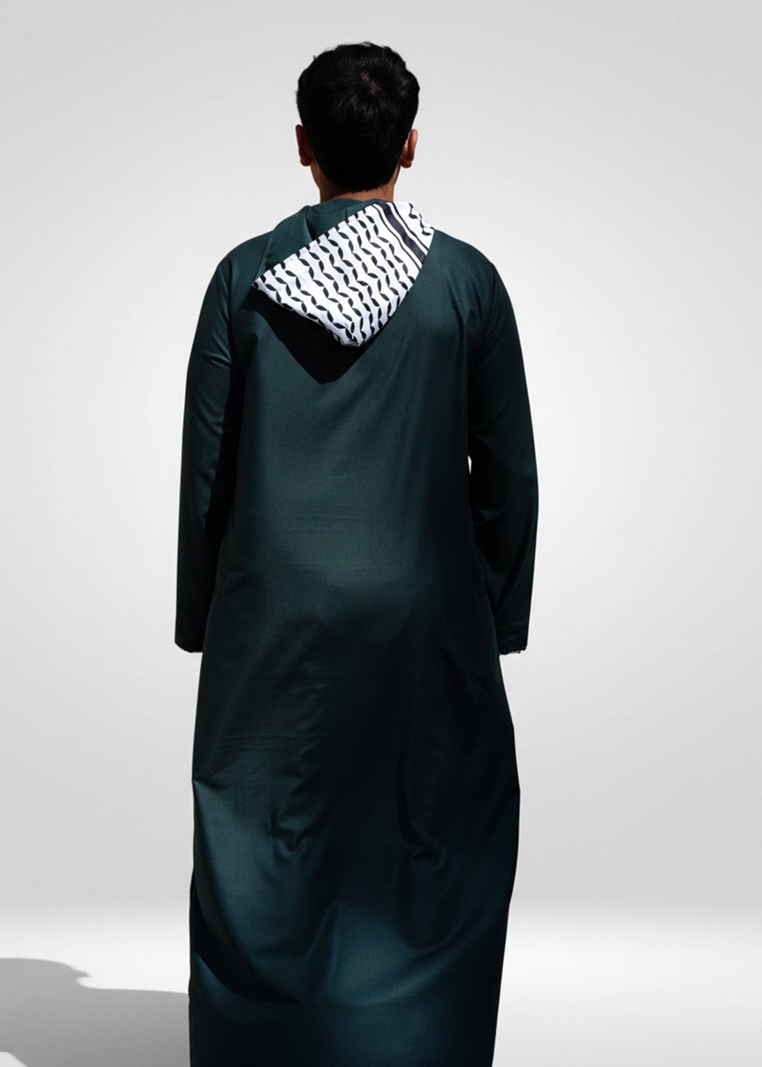 Back view of the Green Palestinian Hoodie Thobe highlighting the cool hooded silhouette and relaxed fit