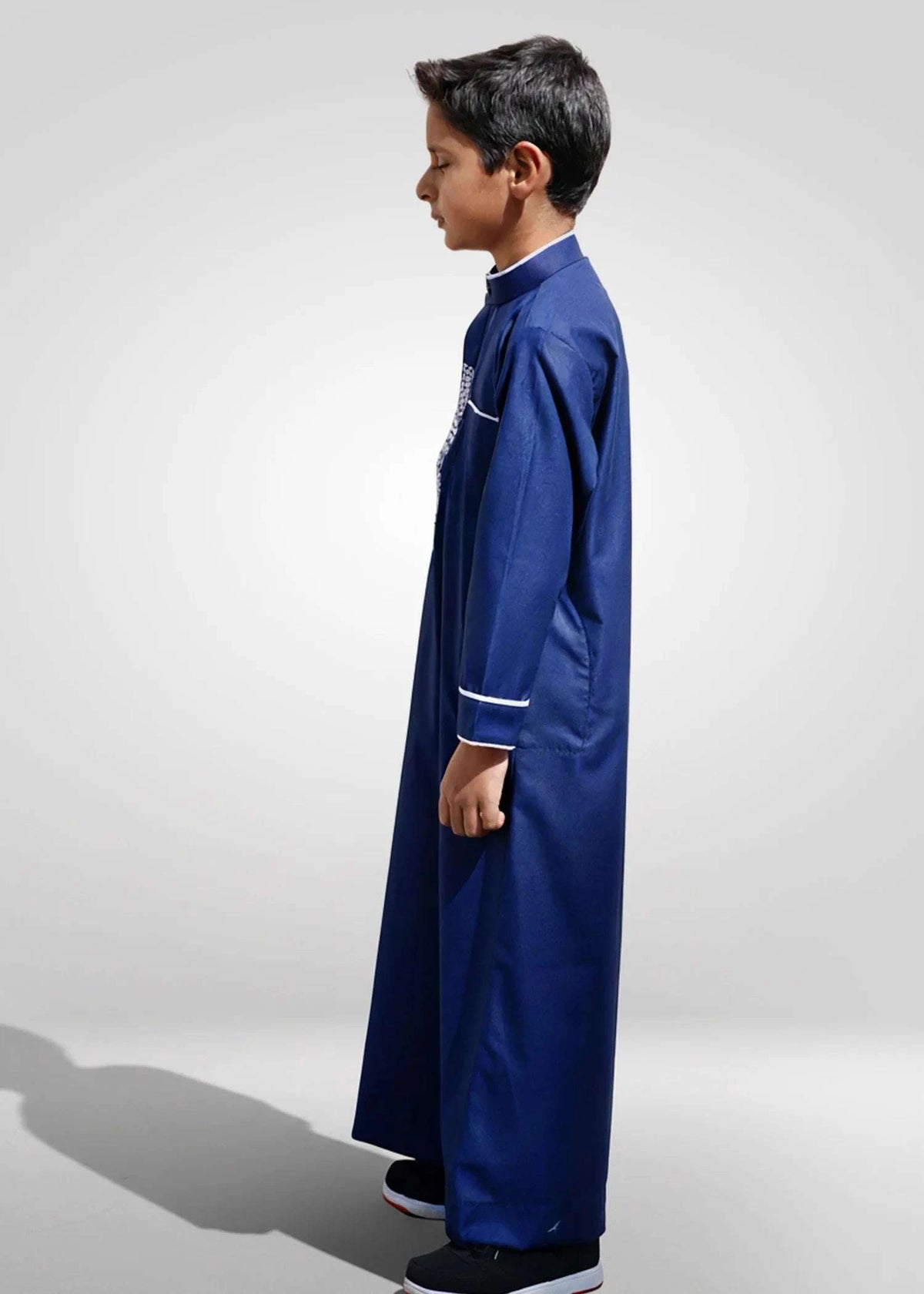 Navy blue embroidered thobe with white geometric detail for boys, sleeve cuff detail