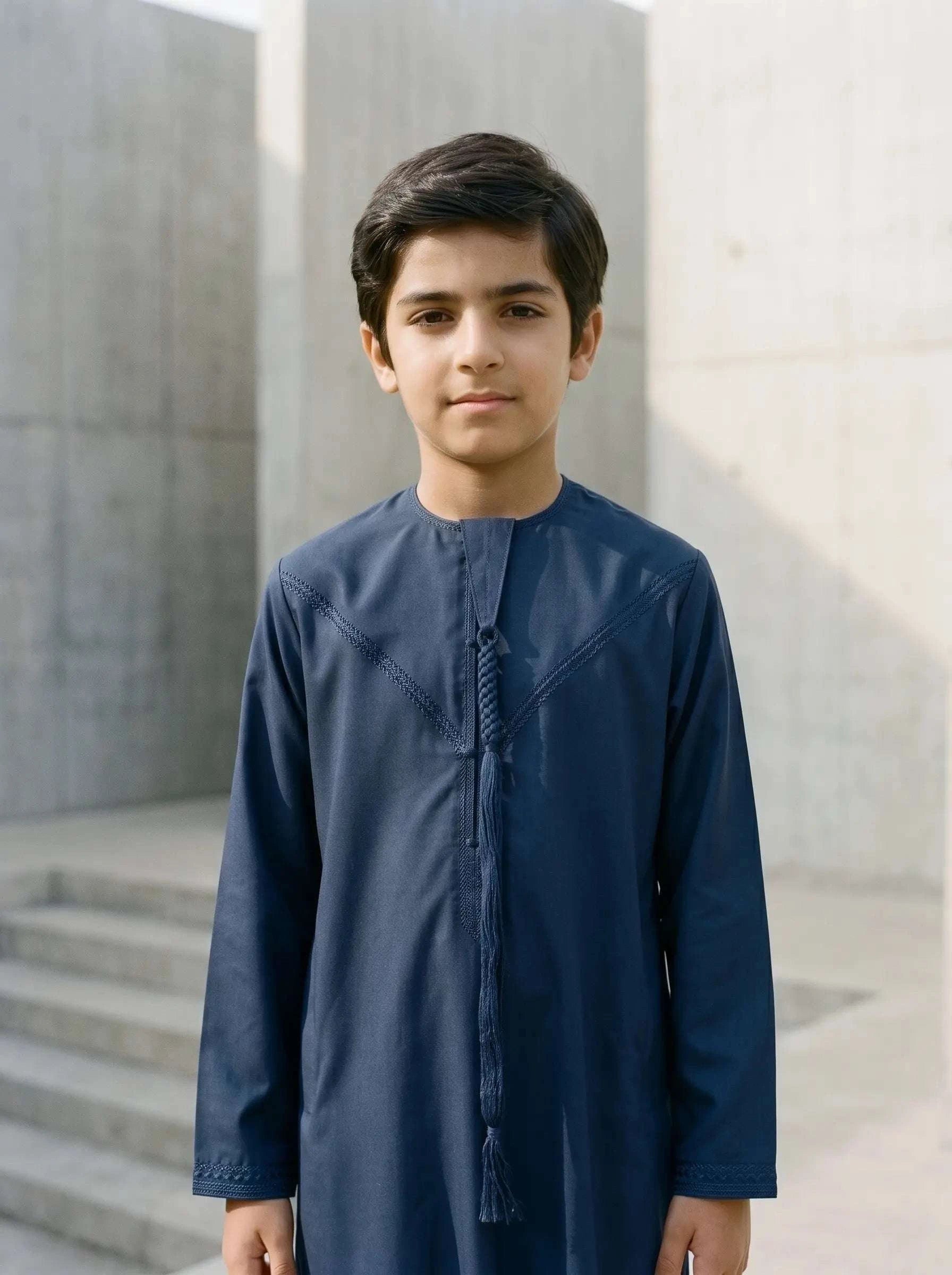 Navy blue Emirati thobe with braided tarboush for boys, side profile view