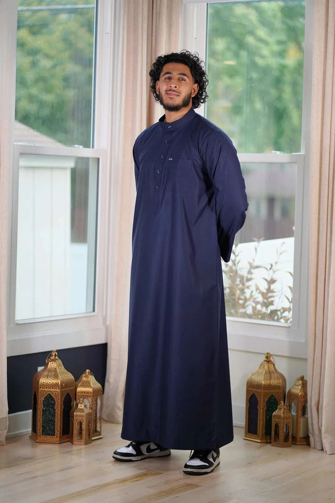 Navy blue thobe with mandarin collar for men, full front view