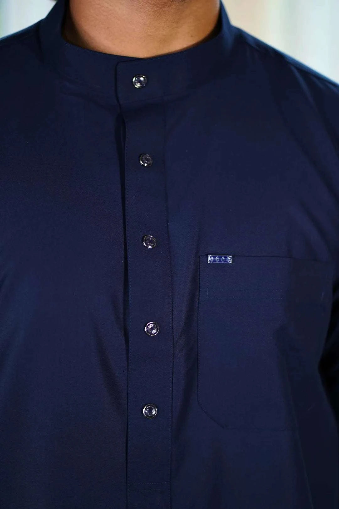 Navy blue thobe with mandarin collar for men, buttoned placket in close detail