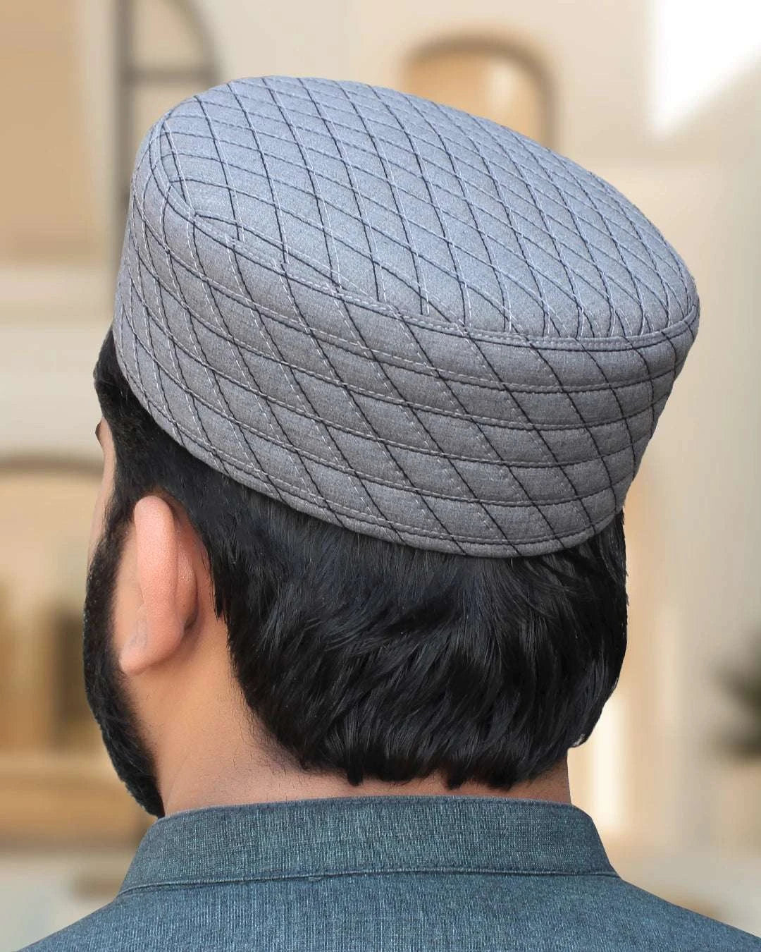 Storm gray quilted kufi prayer cap with silver stitching, a Sunnah wardrobe staple
