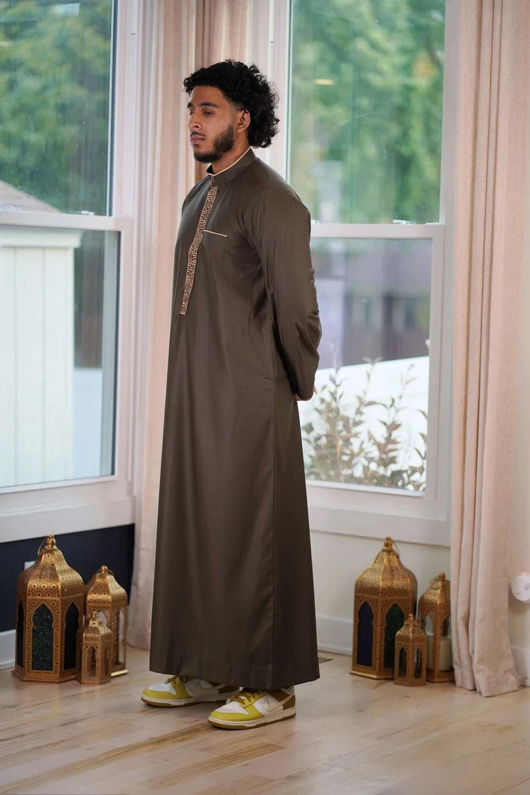 Olive green and gold embroidered thobe for men, embroidery shown in close detail