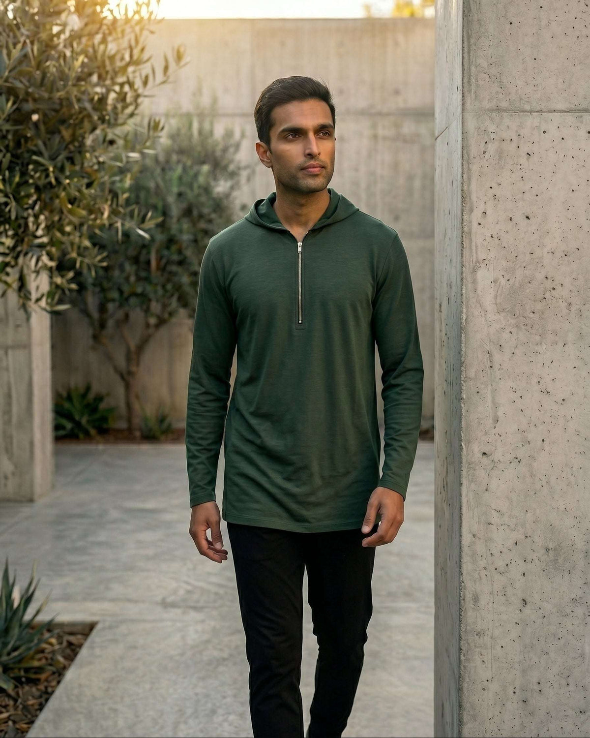 Olive green hooded kurta with half-zip jersey for men, worn by a model outdoors