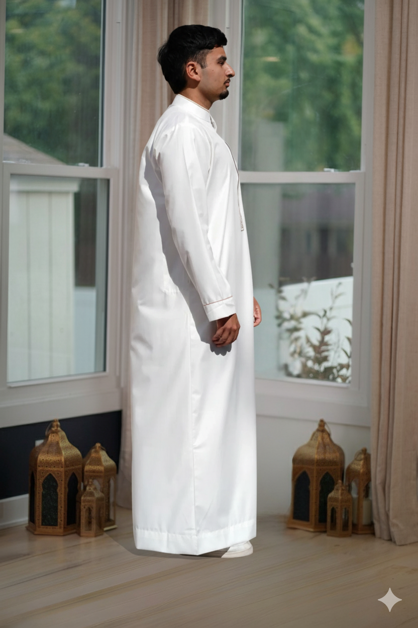 Model wearing the thobe in a lifestyle setting, emphasizing premium Muslim Thobe for Eid and US-wide delivery.