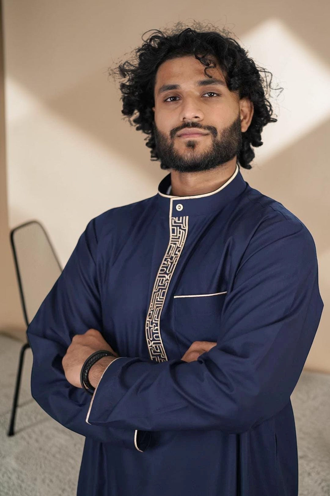 Navy blue and beige thobe for men, close-up of the embroidered detailing