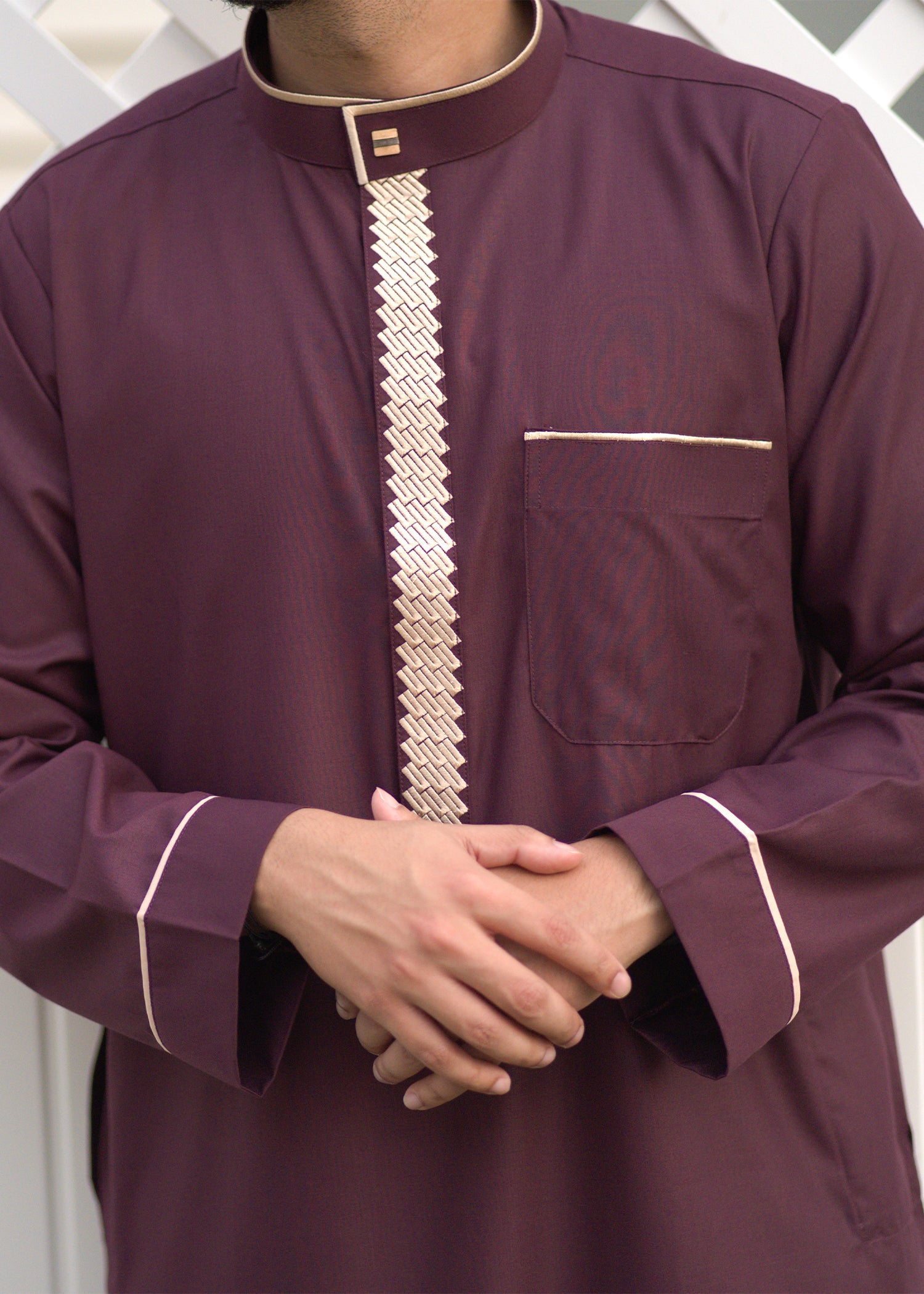 Close-up of the exclusive gold embroidery and mandarin collar neckline on the premium Jubba in New York.