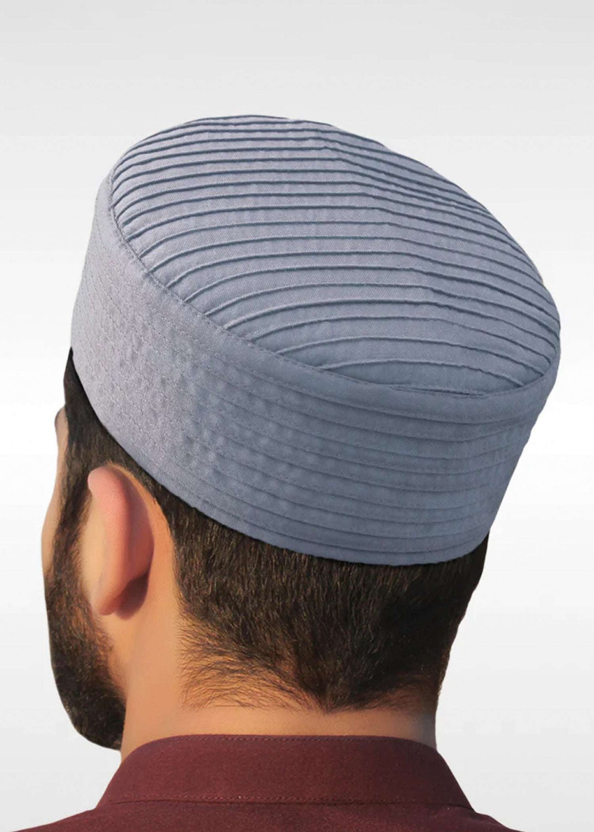 Light gray ribbed structured kufi prayer cap for men, stitched surface in close detail