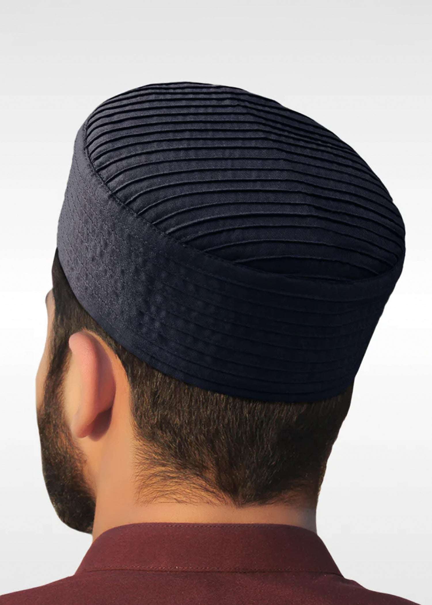 Navy blue ribbed structured kufi prayer cap for men, close-up of the stitched crown