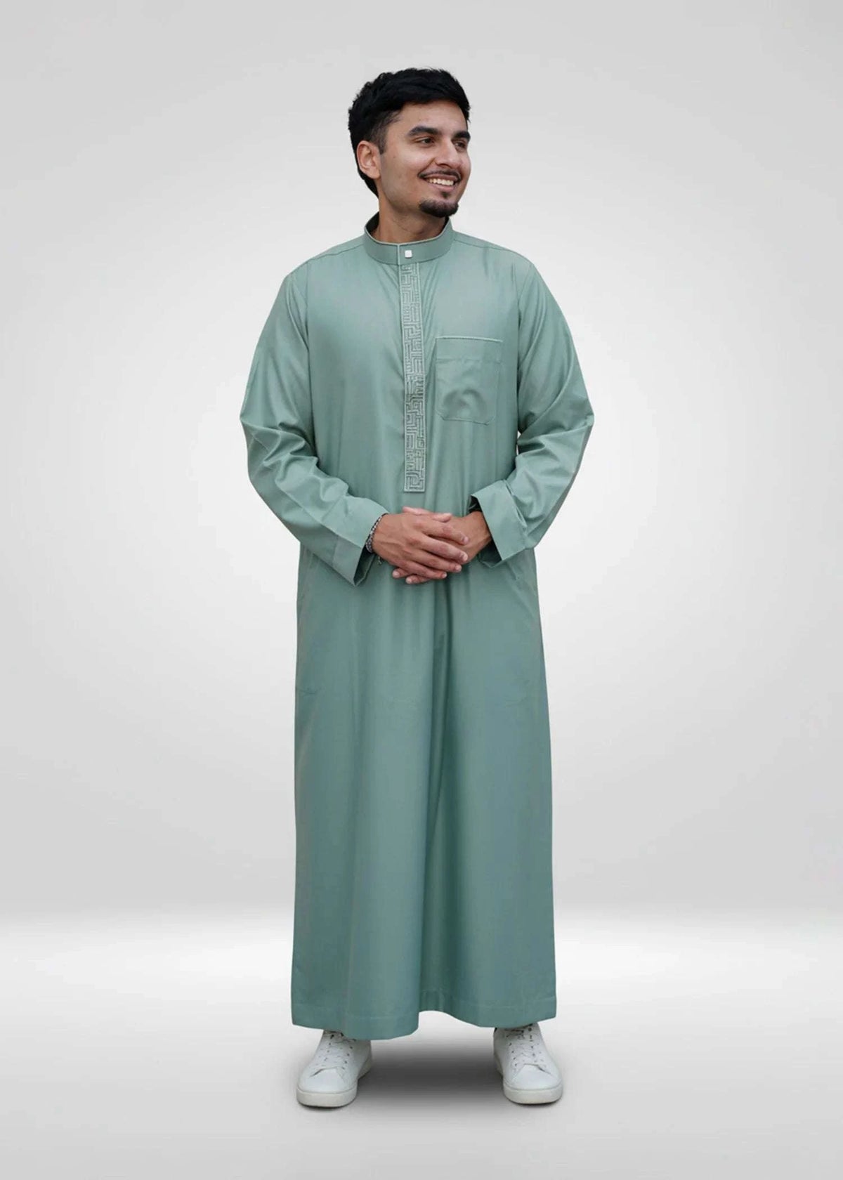Sage green embroidered thobe with mandarin collar for men, close-up of the fabric