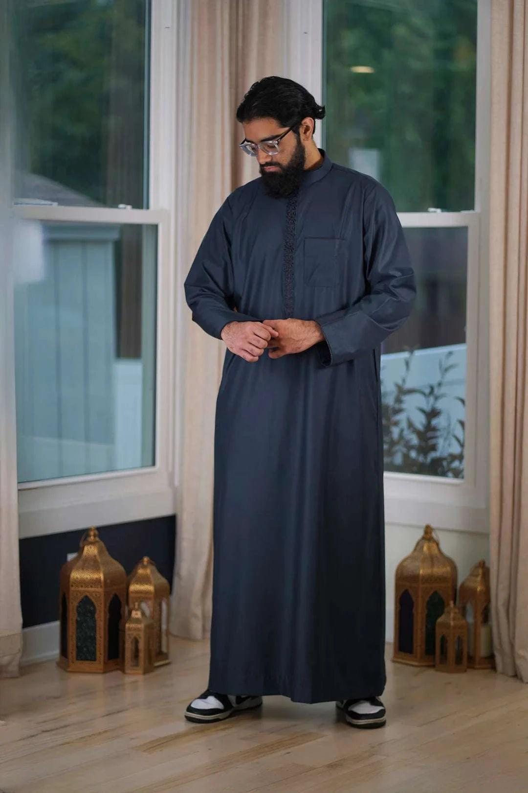 Slate blue embroidered thobe with mandarin collar for men, buttoned placket in close detail