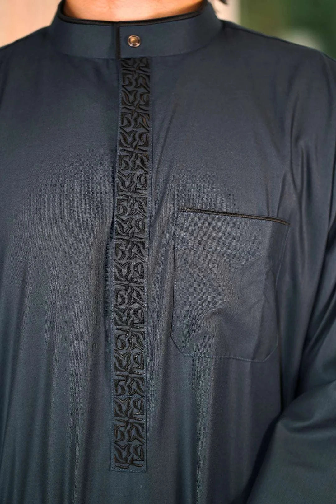 Slate blue embroidered thobe with mandarin collar for men, stitched pattern in close detail